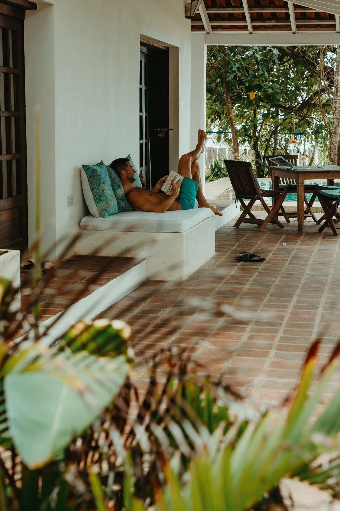 Reading on the veranda of Mawimbi cottage.