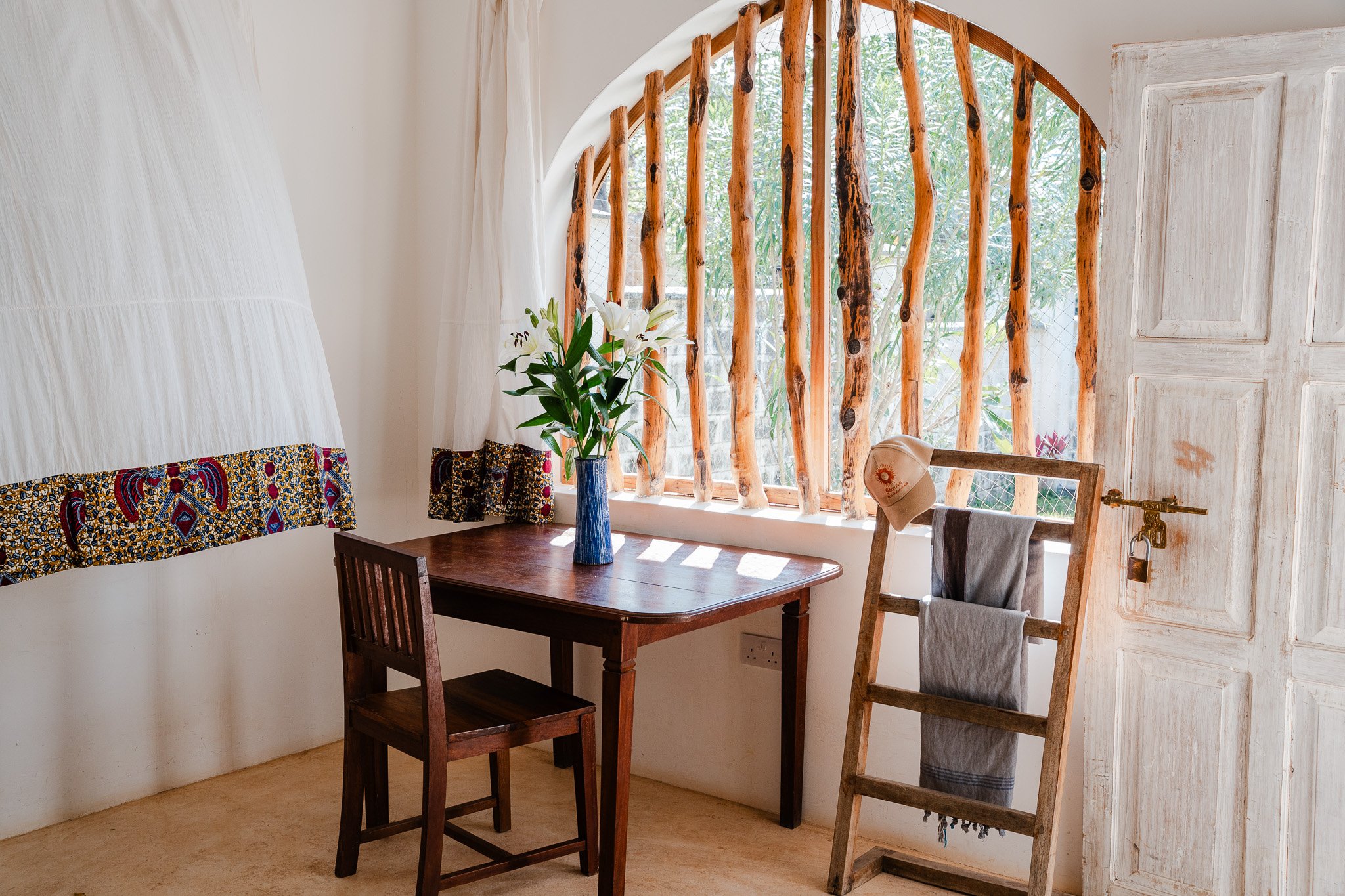 Outside studio with a king-size bed, desk, and en-suite bathroom.