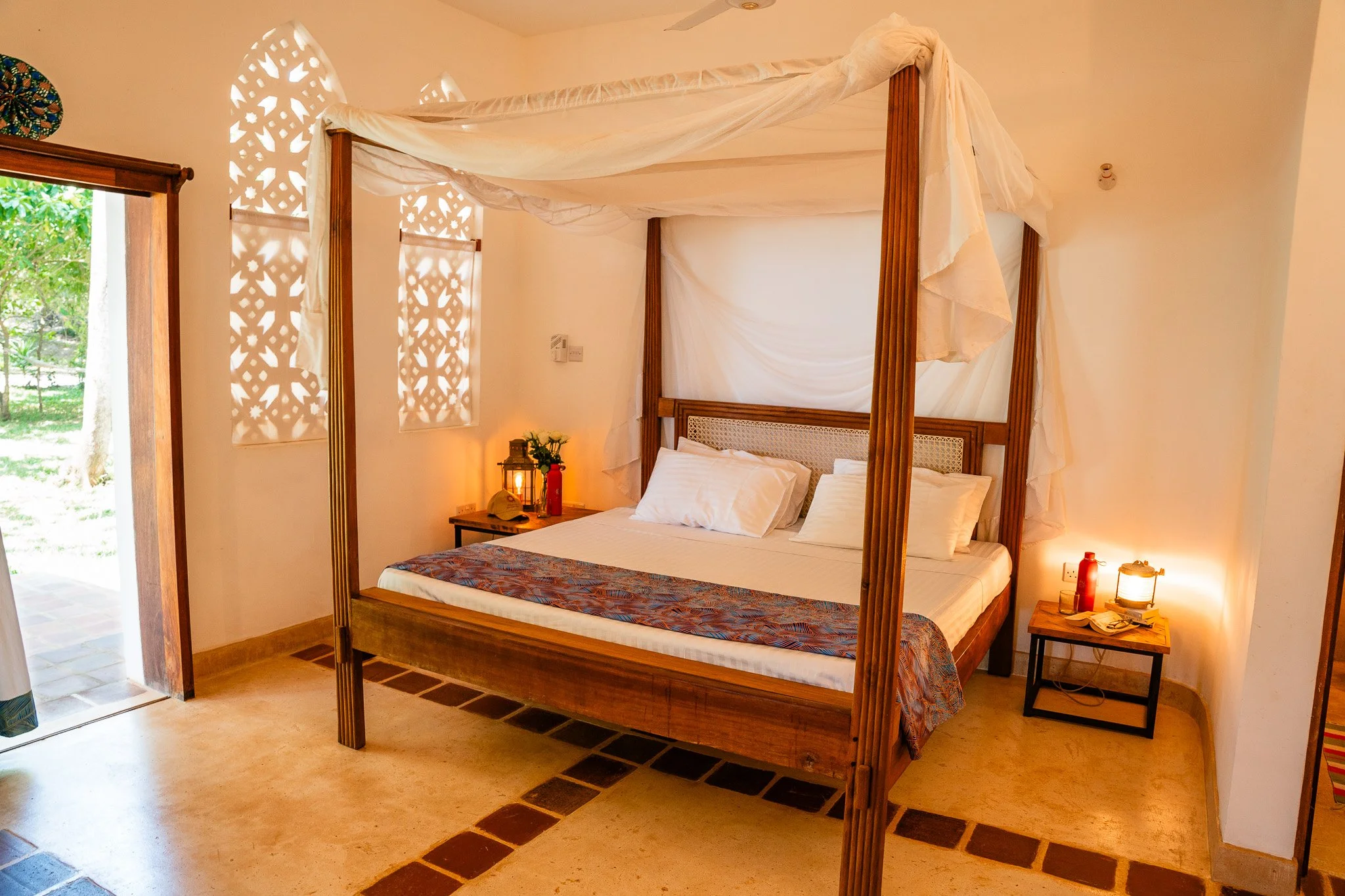Main bedroom features a king-size bed, en-suite bathroom, tv with netflix, cupboard space and doors leading to the veranda.