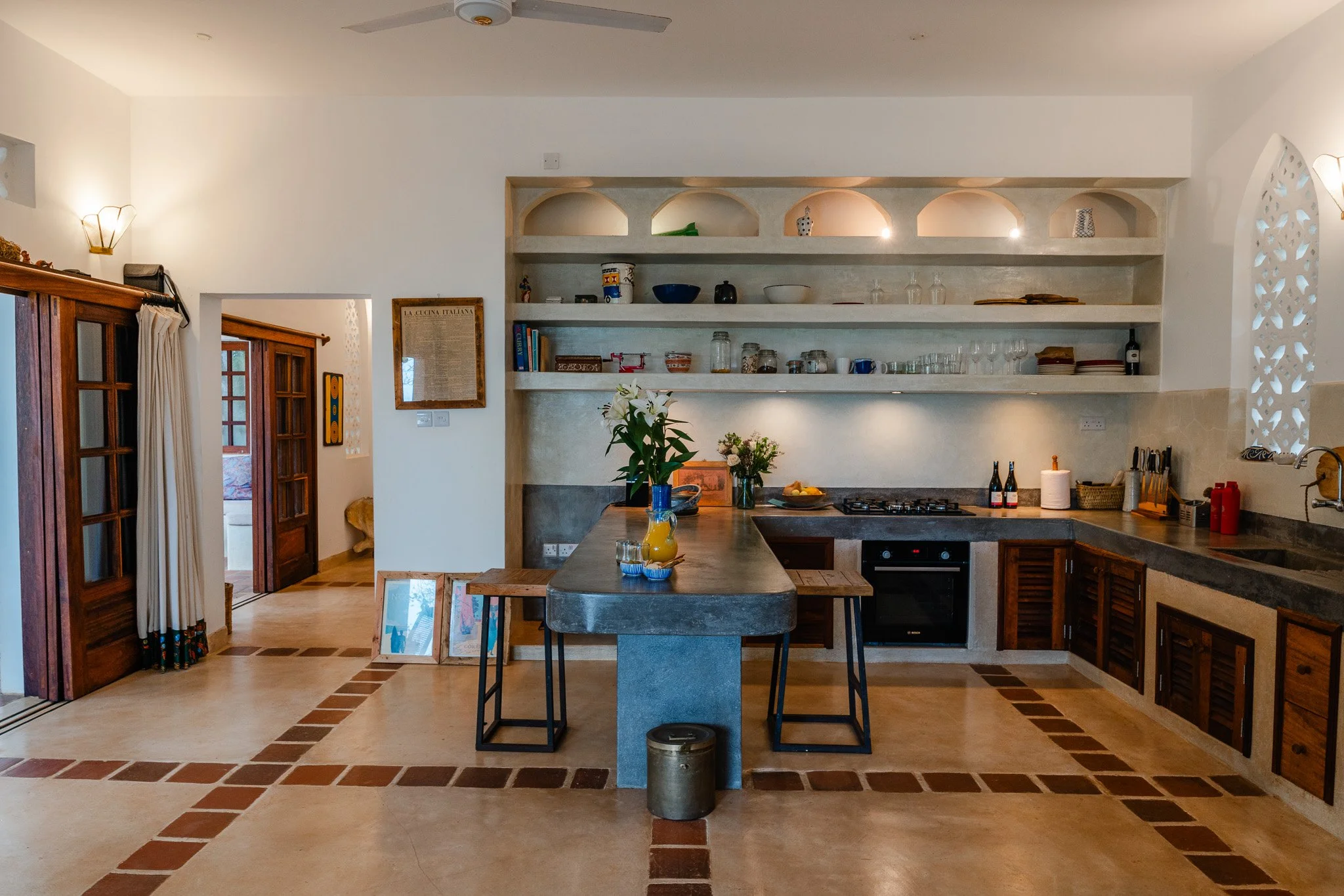 The house features a large downstairs open-plan, fully equipped kitchen which opens up onto the veranda.