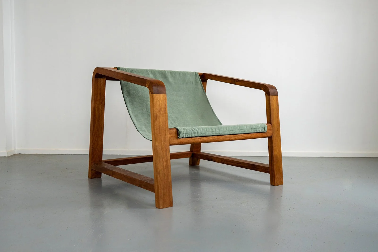 Wrangler occasional chair with sage green fabric sling, handmade from Tasmanian blackwood in Torquay