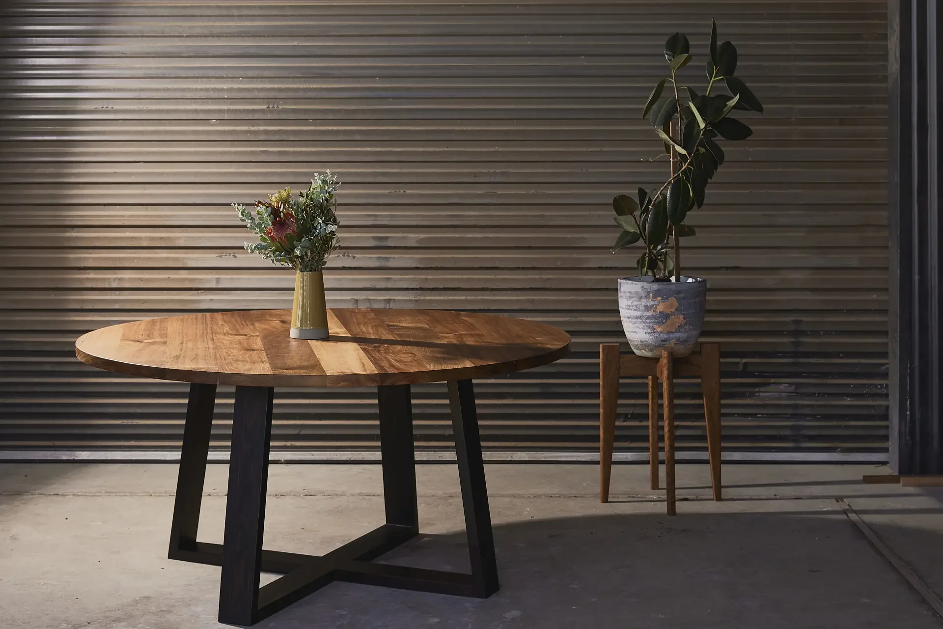 Tasmanian blackwood round dining table & recycled messmate plant stand. Hand made on the Surf Coast by Georgie Wood.