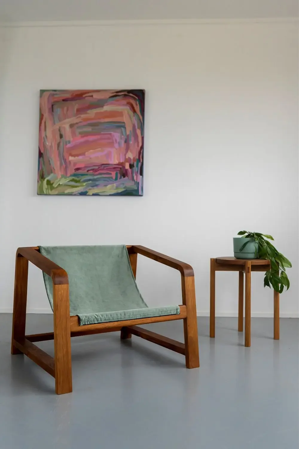 Wrangler chair in Tasmanian Blackwood and sage green velour sling. Matched with small round side table. Both hand made on the Surf Coast by Georgie Wood. 