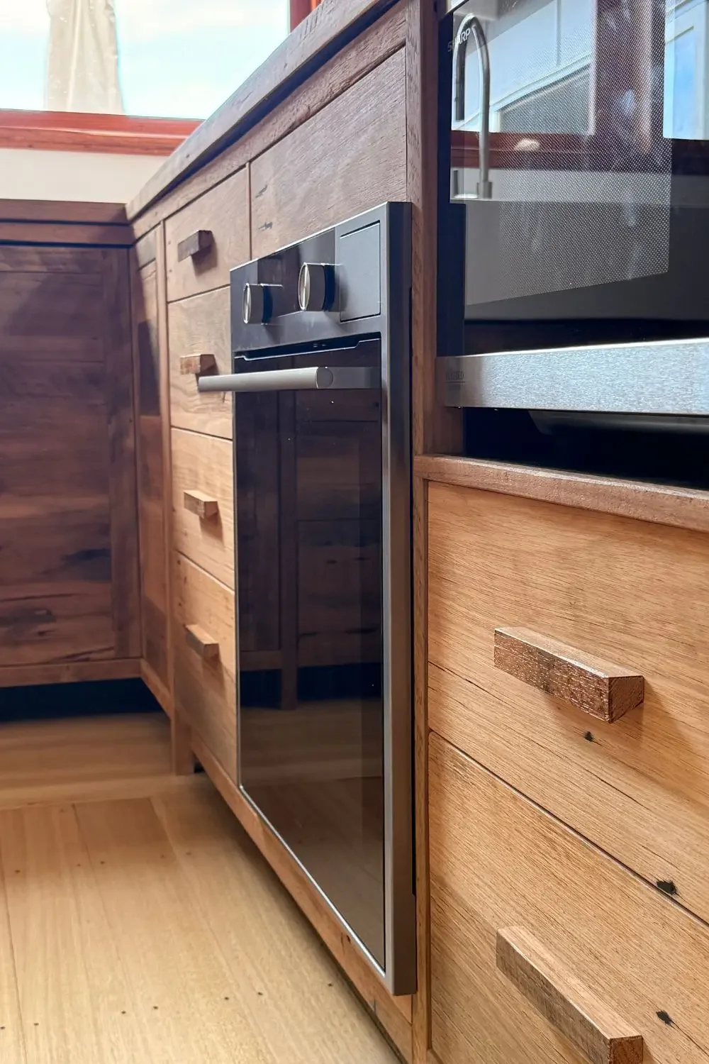 Custom kitchen cabinetry to fit oven & microwave