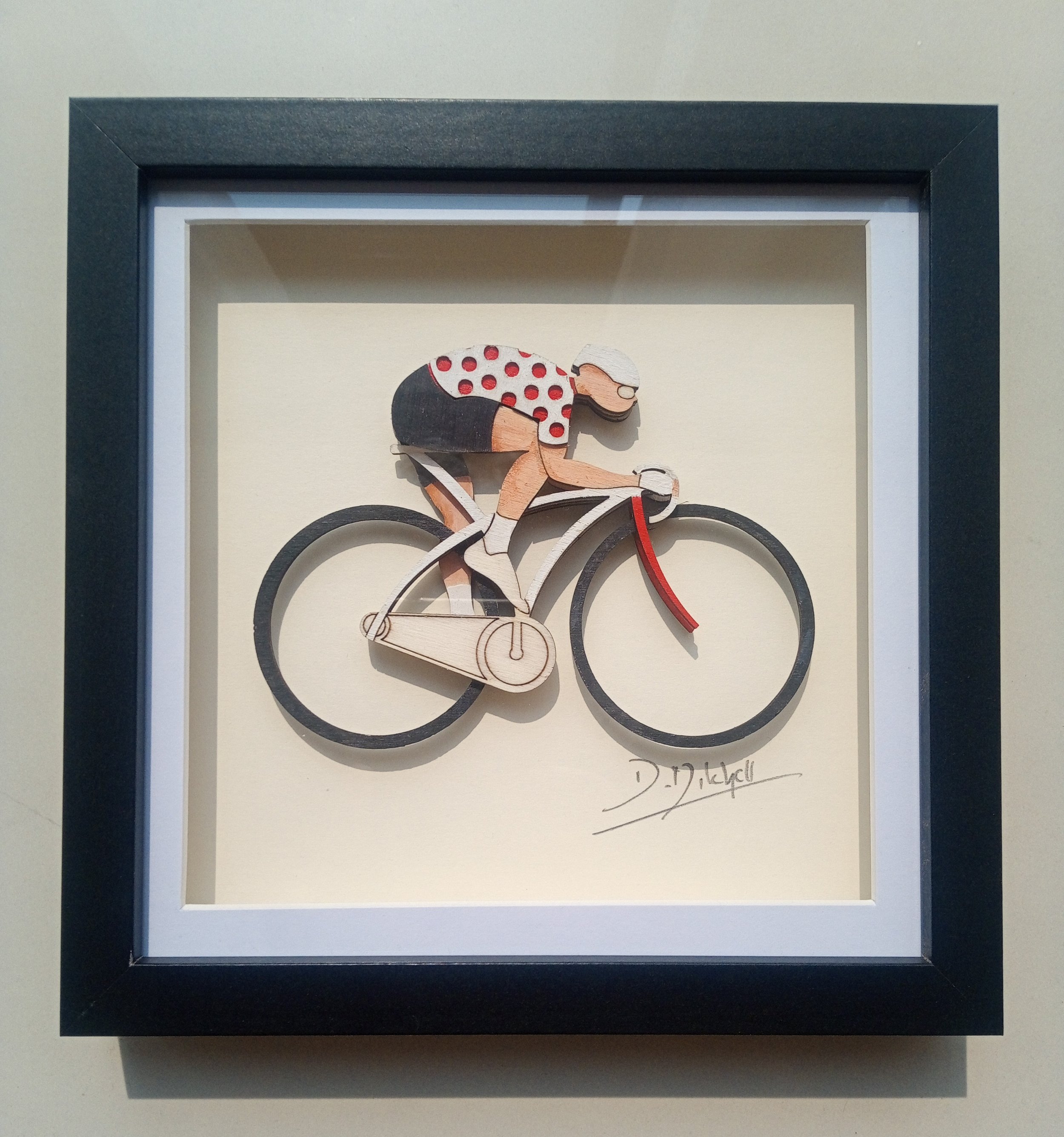 Polka dot jersey cyclist
