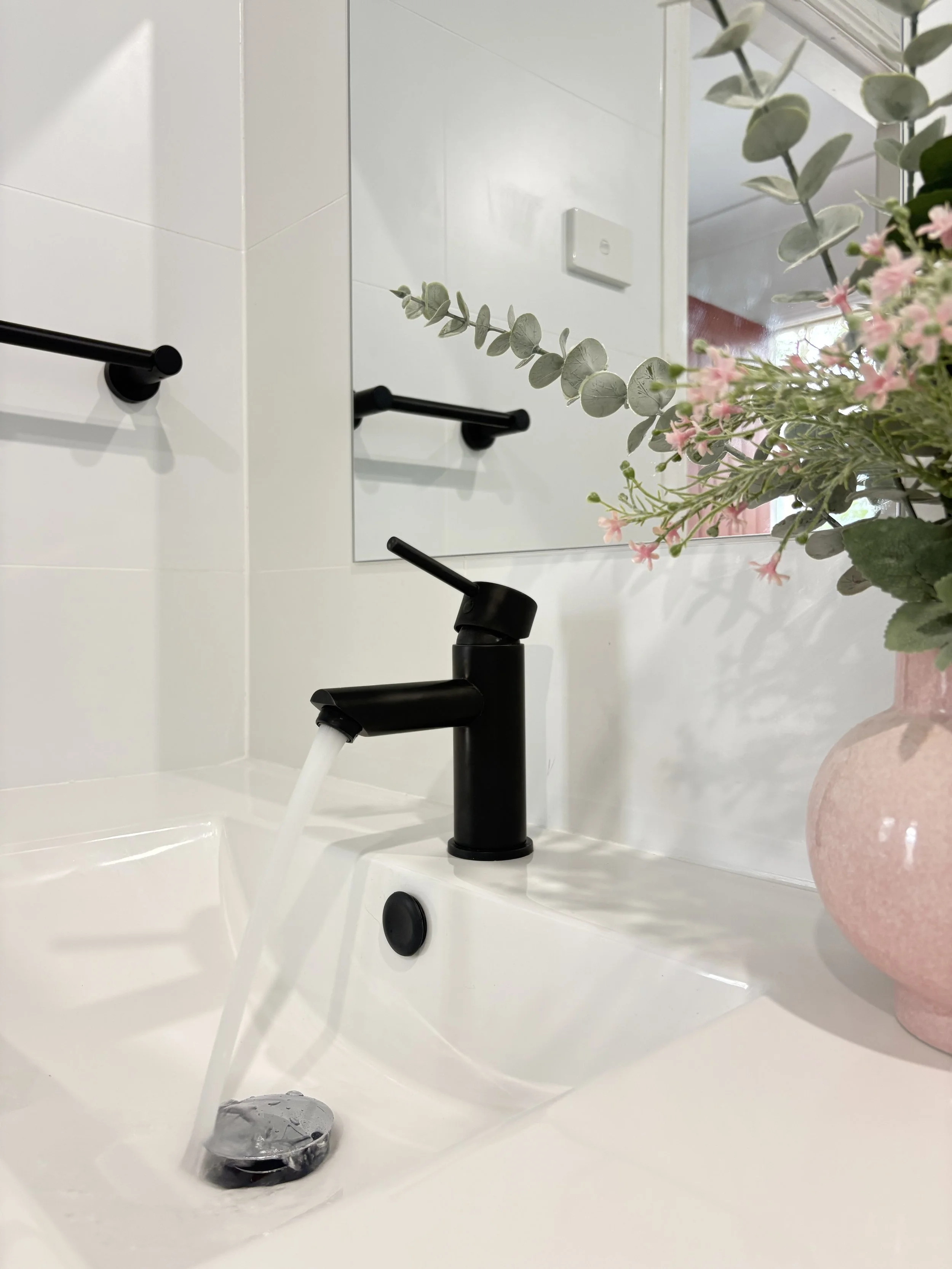 Black tap in bathroom