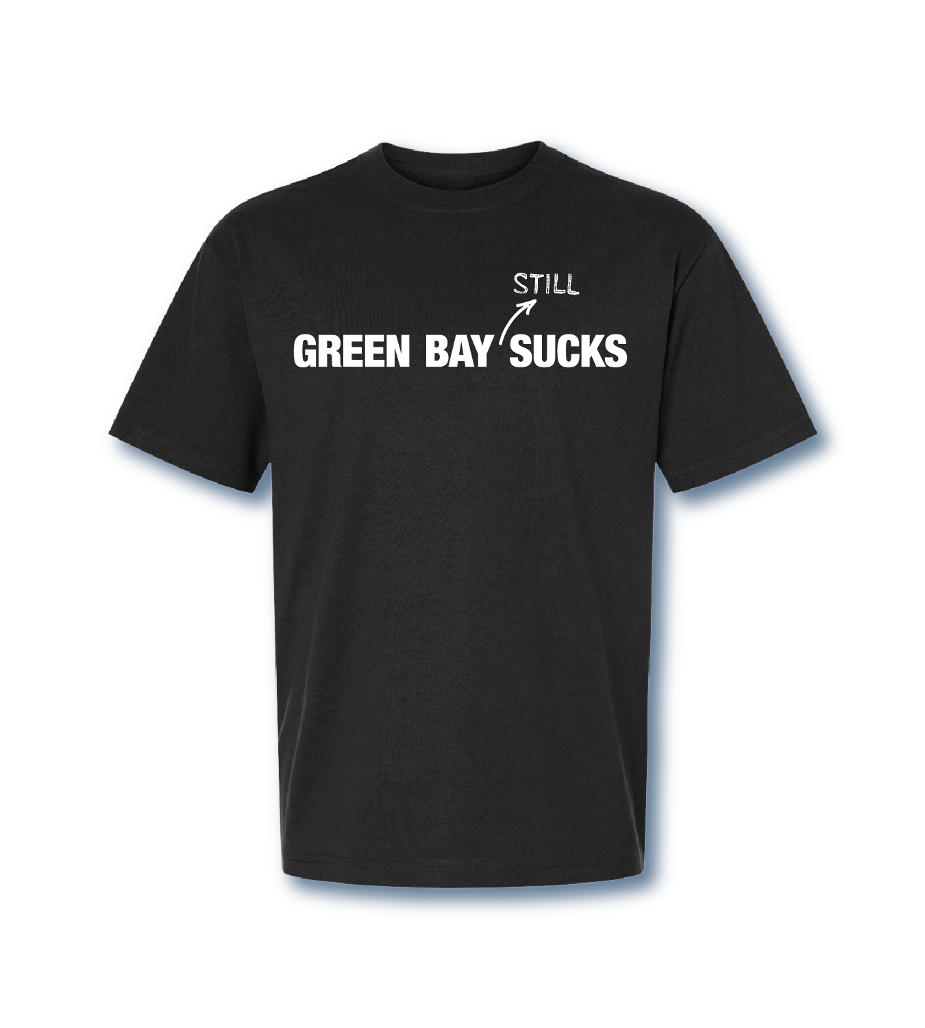 Black T-shirt with bold white text reading 'Green Bay Sucks' and a smaller handwritten style text above it saying 'Still' with an arrow pointing to the larger text.