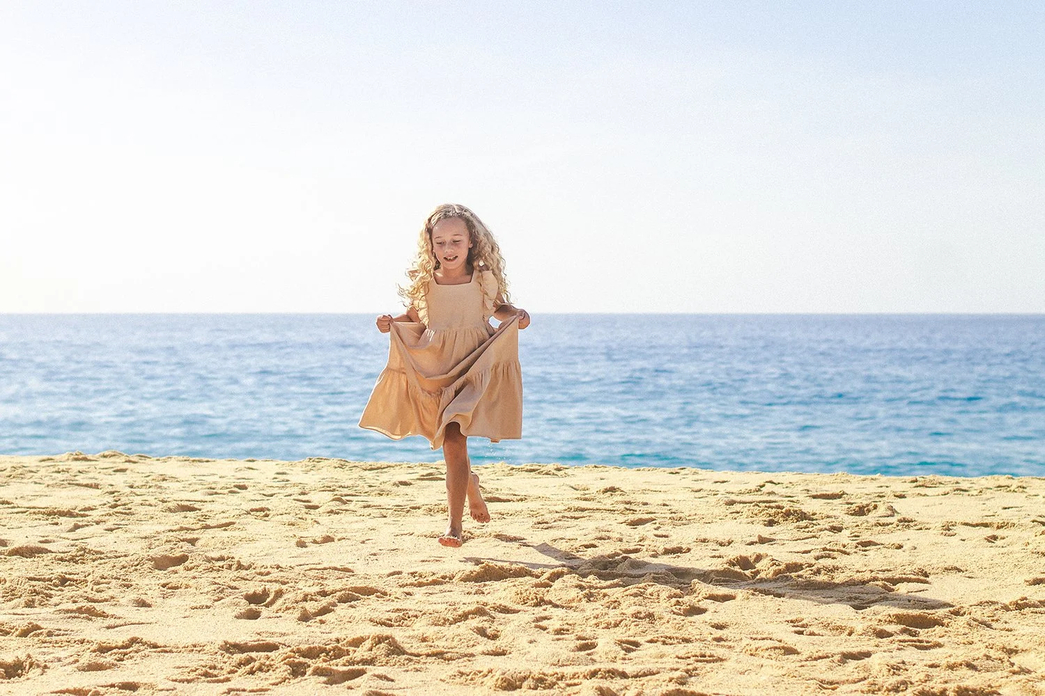 little-girl-on-beach-in-cabo.jpg
