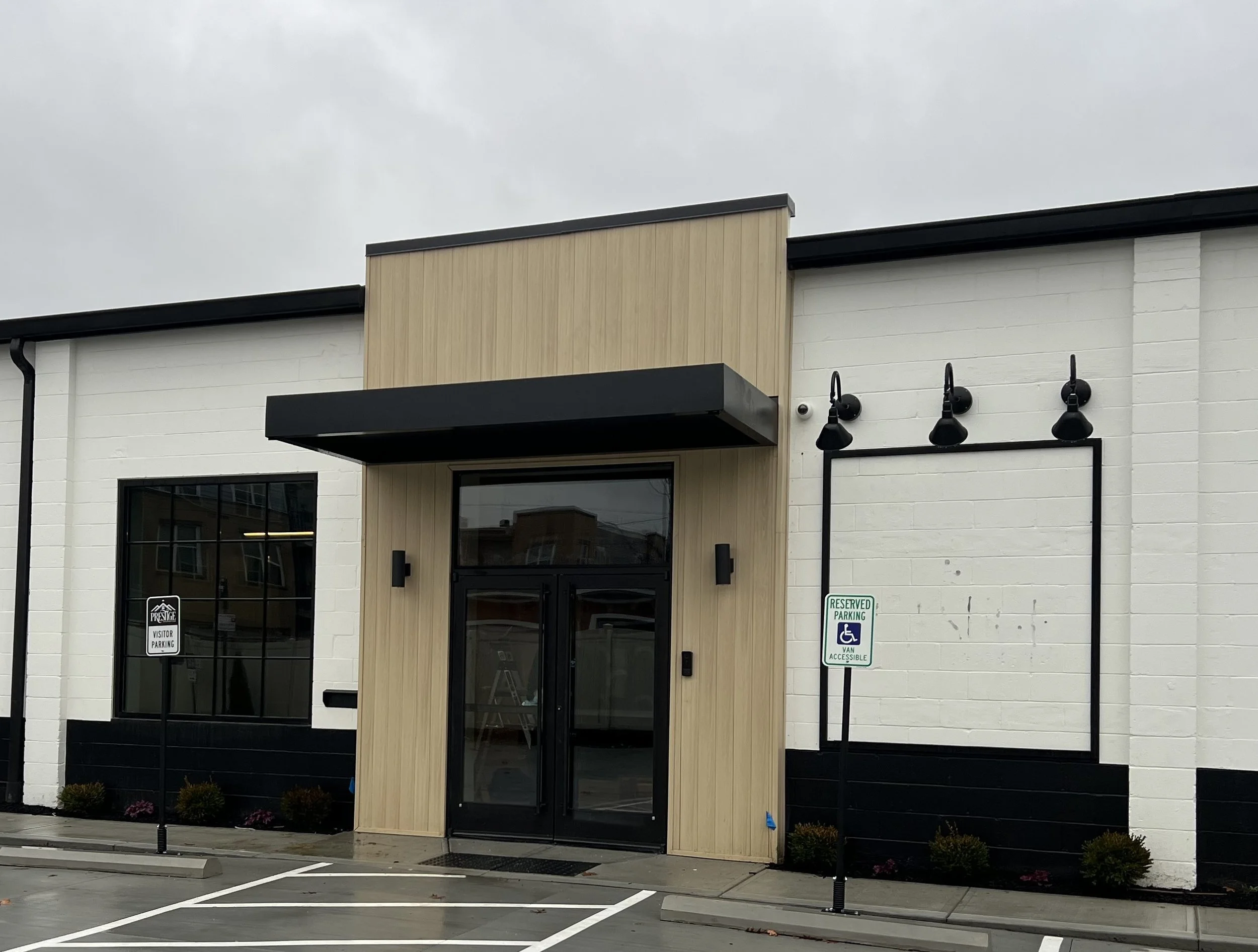Cantilevered Metal Canopy with Soffit panels