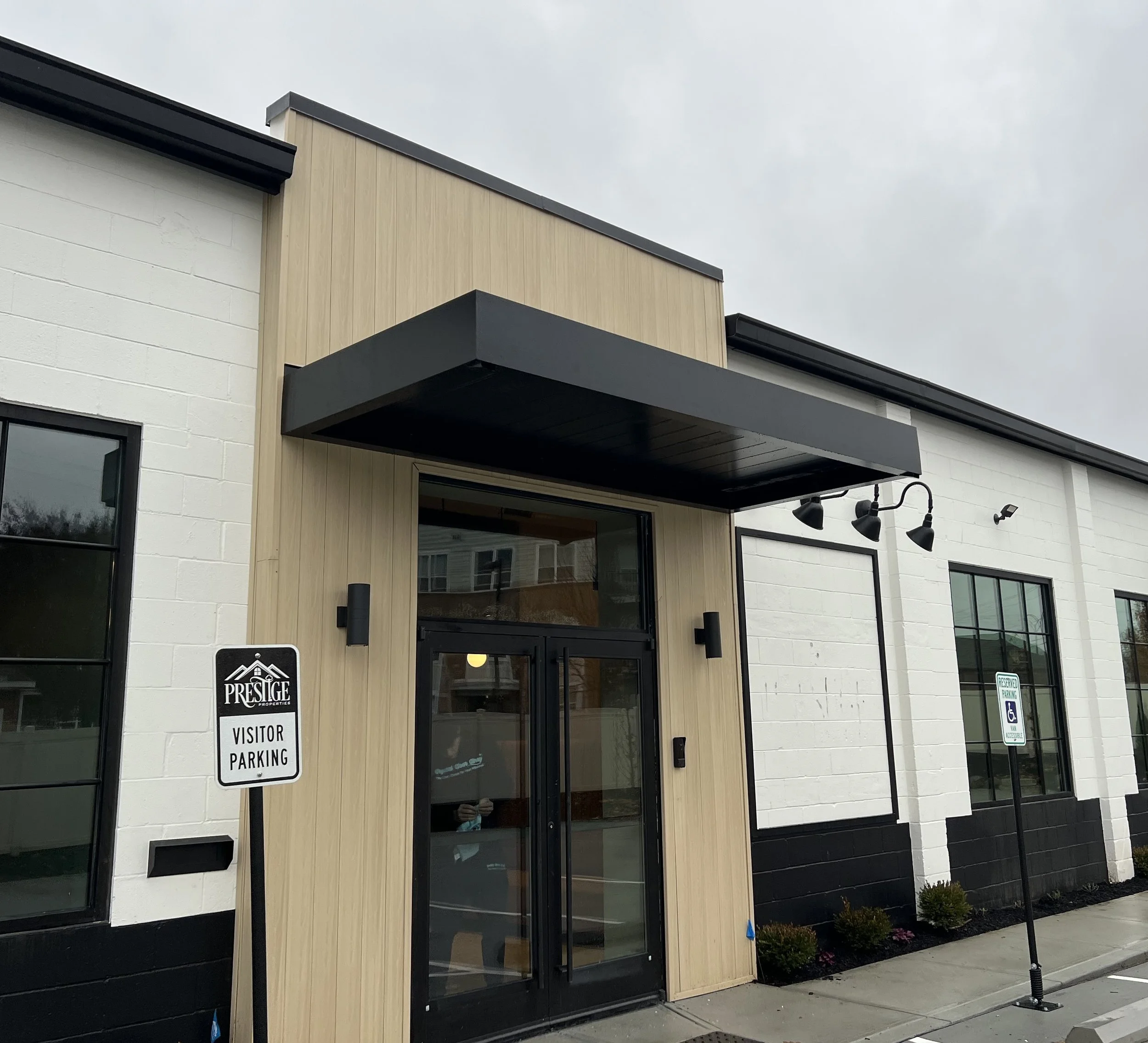 Cantilevered Metal Canopy with Soffit Panels