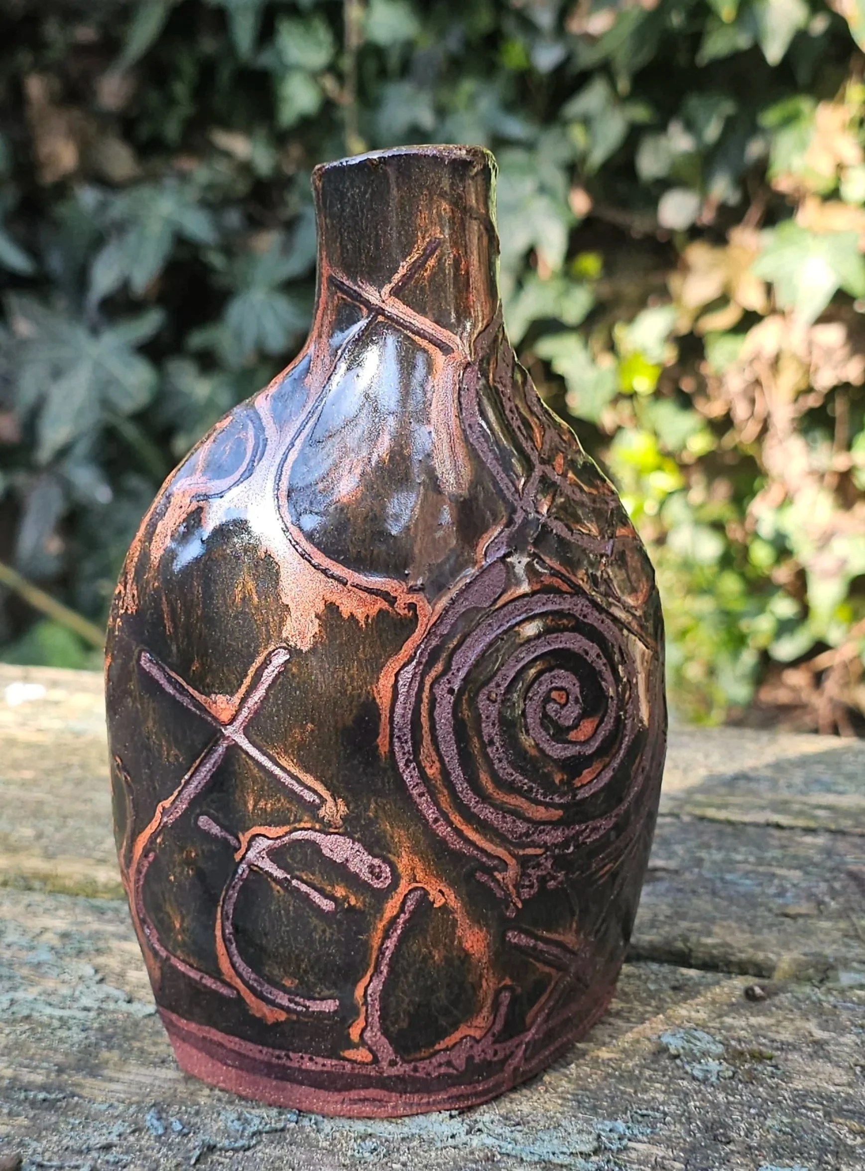 red stoneware with copper glaze 17 cms high £40