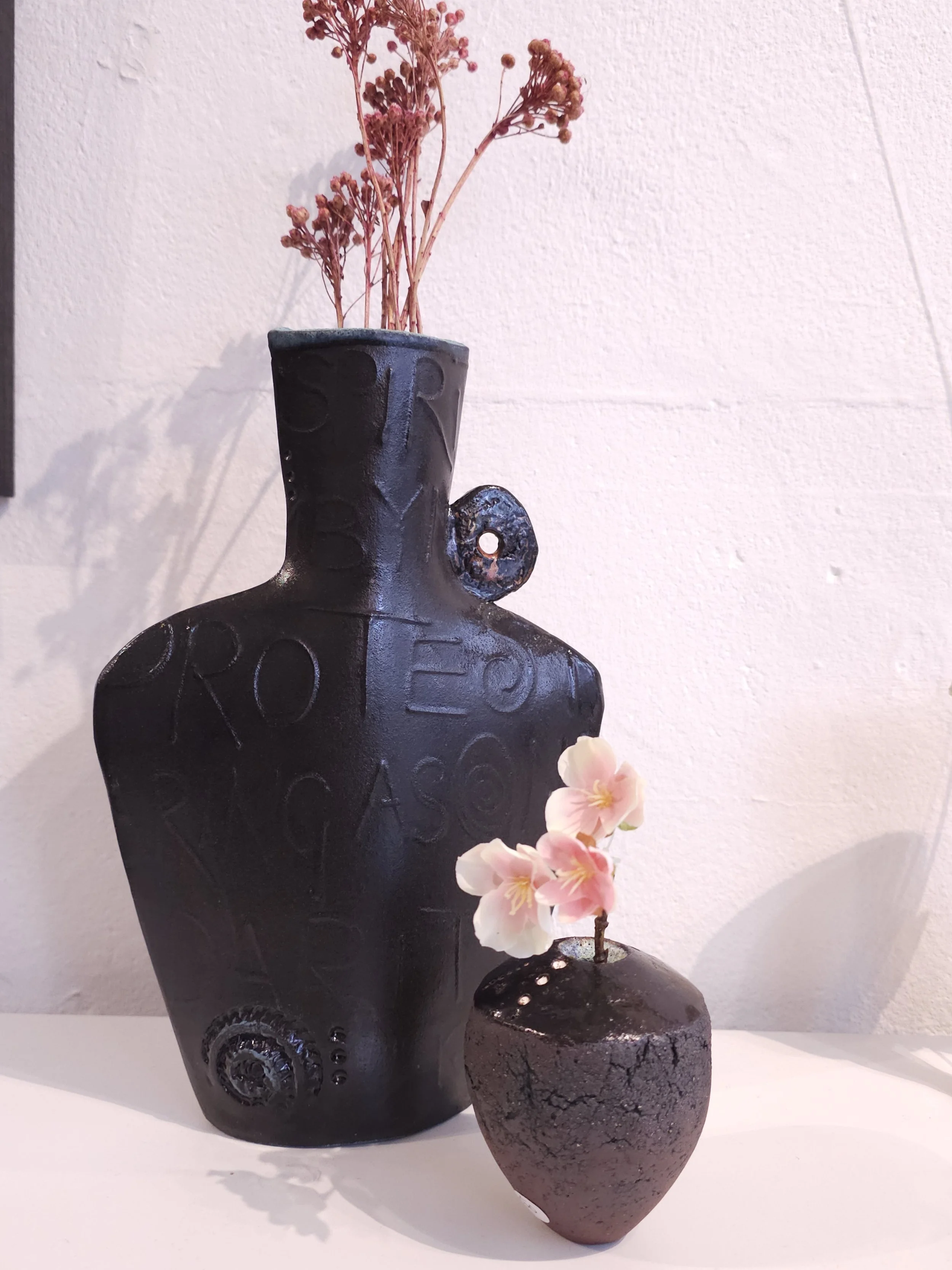 black stoneware vase 25cms. £60. Red stoneware small vase 10cms high £40