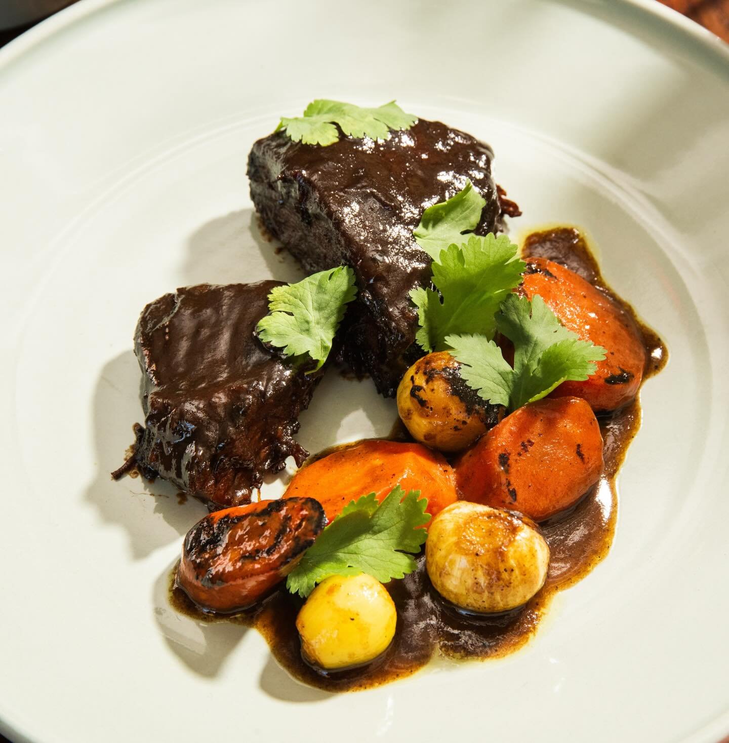 coffee-braised brisket: dates, carrots, pearl onions, hawayej served with basmati rice.