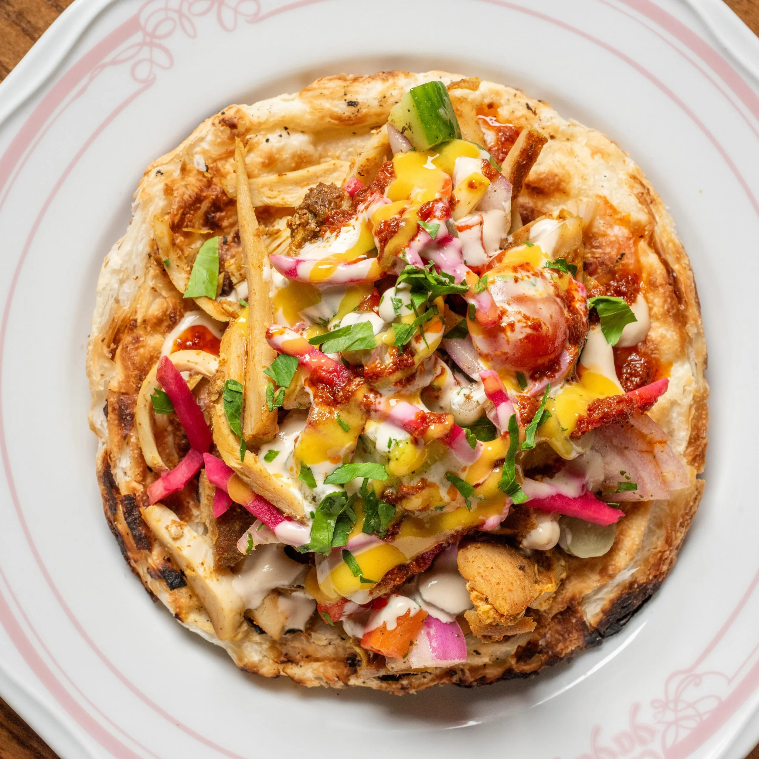lunch: the chicken shawarma wrap.

crispy yemenite flatbread, tahini, shepherd&rsquo;s salad, Persian pickles, harissa + amba mustard.