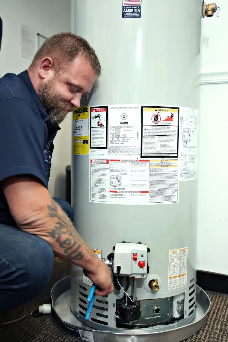 Technician replacing a water heater