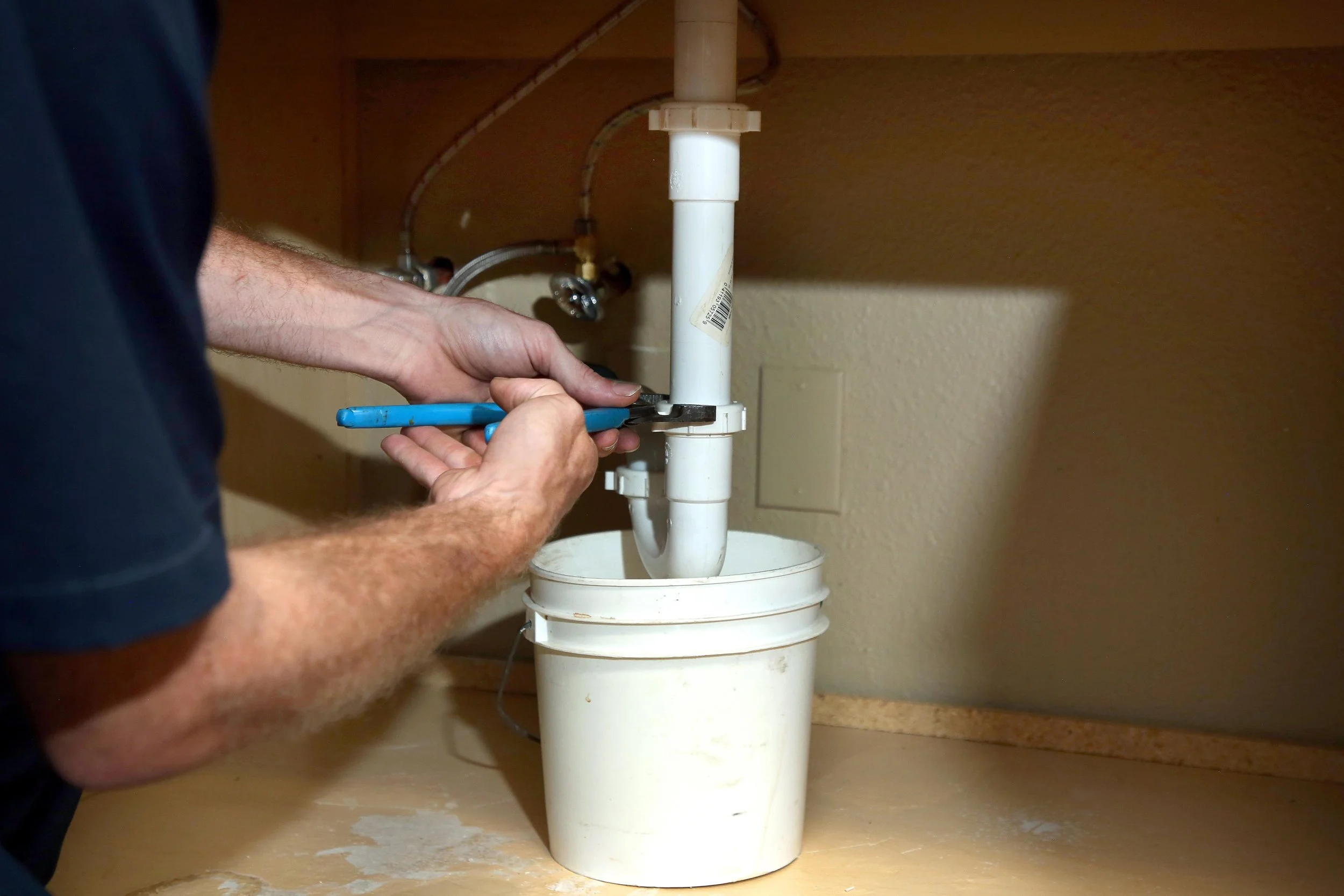 plumber repairing a drain