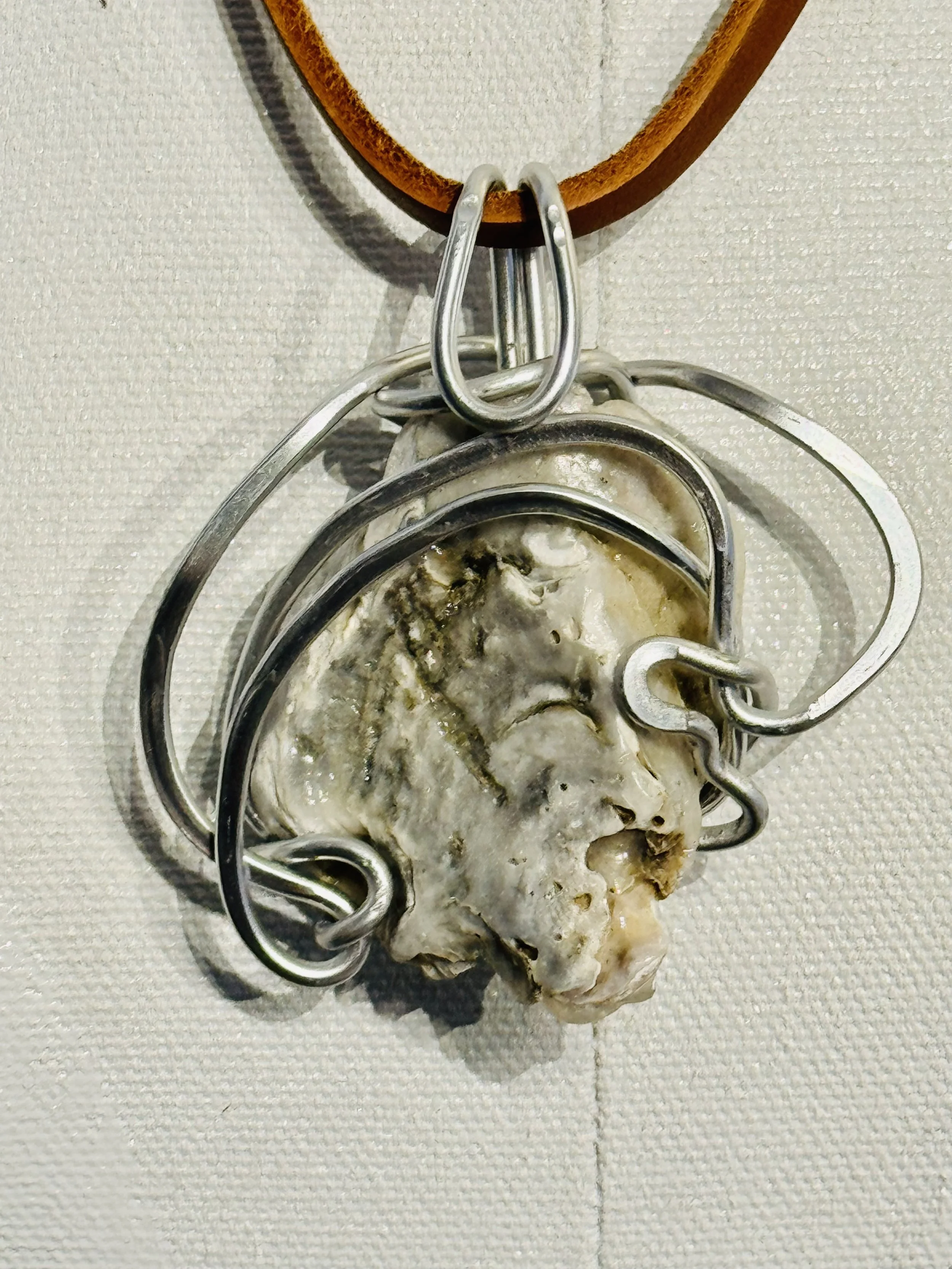 This exquisite pendant is inspired by its resemblance to Jesus Christ, featuring prominent Christian motifs. The interlocking wire circles represent the unity and equality of the Father, Son, and Holy Spirit.