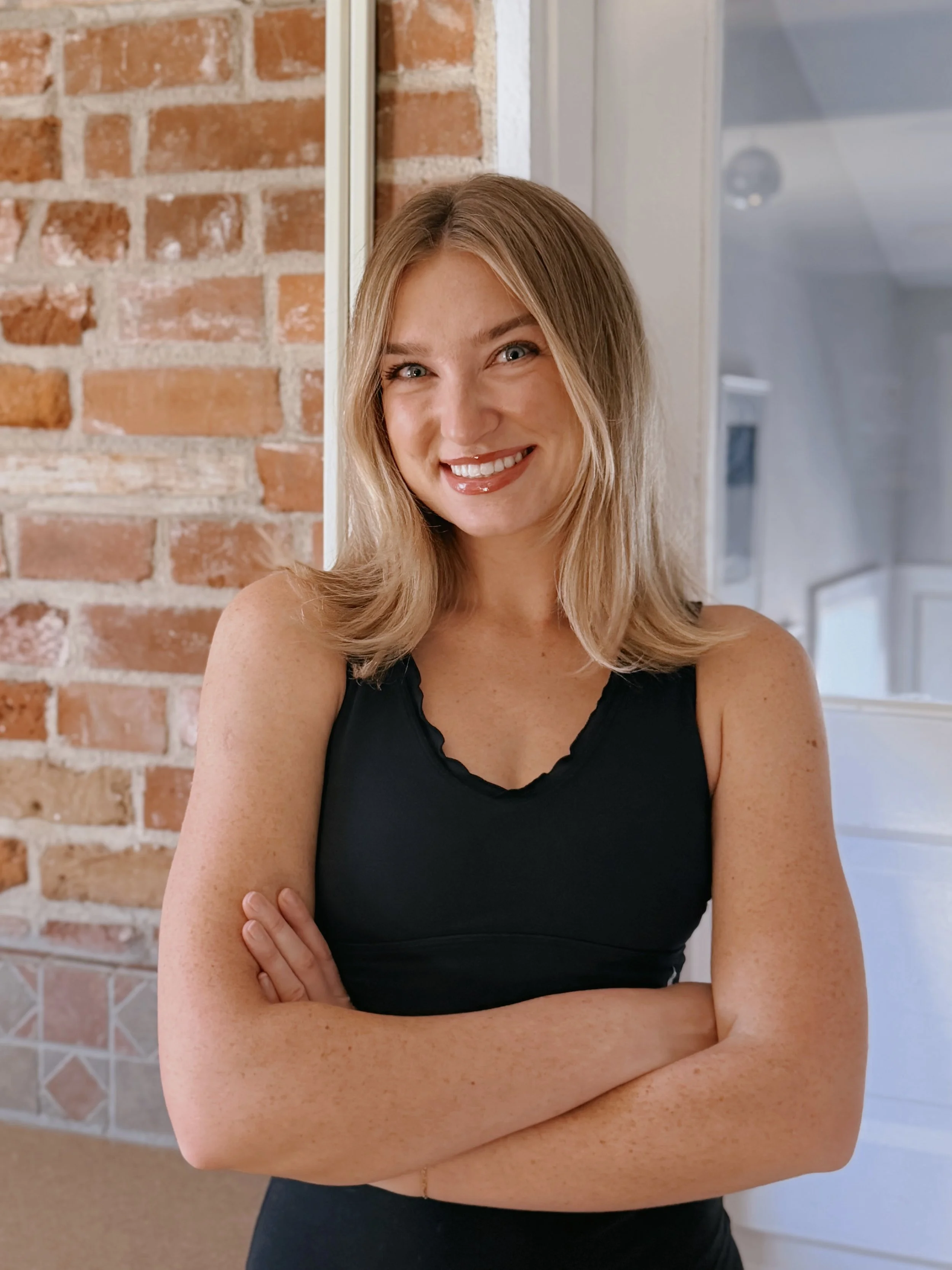 Aspen, certified Reformer Pilates instructor at Arc Pilates in LoHi Denver, teaching private and duet Pilates sessions in a boutique Pilates studio focused on personalized movement and wellness.
