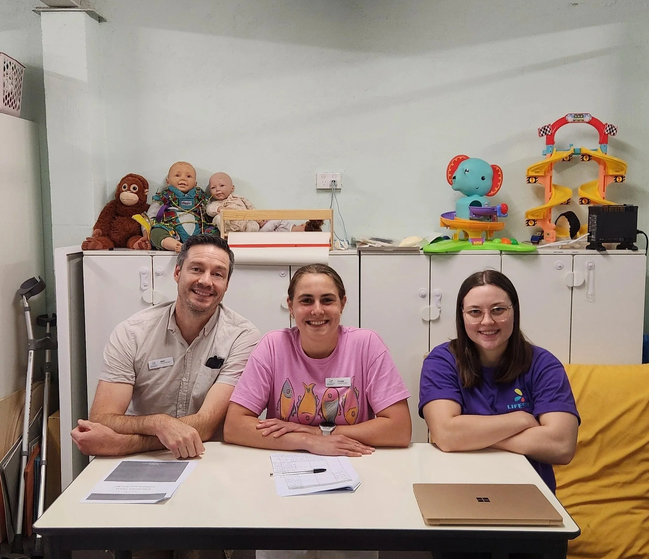 Coach supporting inclusive participation for young athletes with different physical and sensory needs