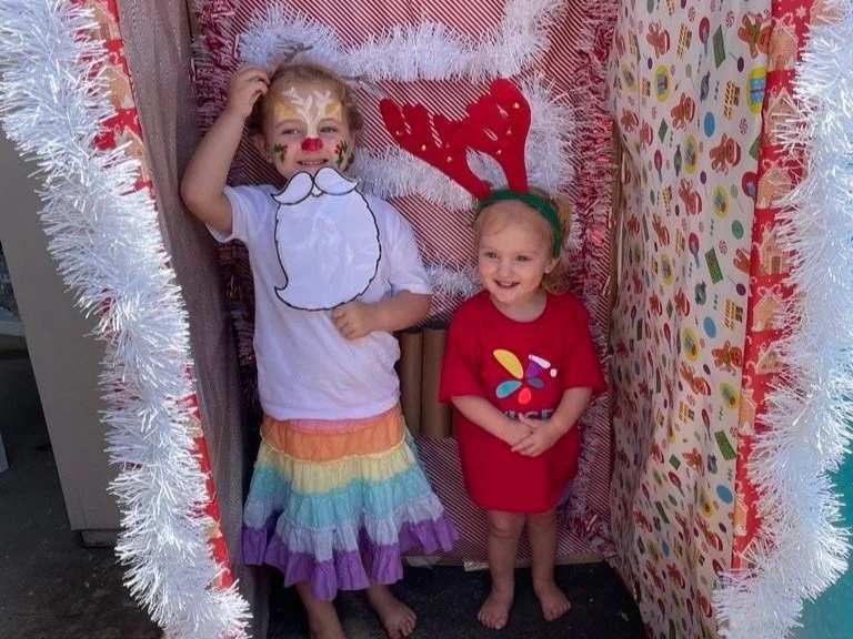 Physiotherapist and Director Liz Donnellan working with children and children with disabilities at Lifespan Therapies in Strathpine, North Brisbane. Her two daughters are pictures dressed up for the Lifespan Therapies community Christmas party.