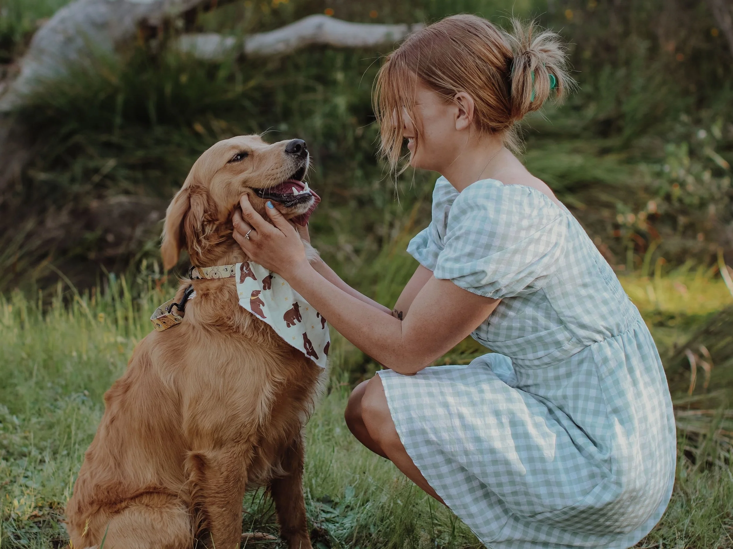 Occupational Therapist Emma Joss working with children and children with disabilities at Lifespan Therapies in Strathpine, North Brisbane. Pictured kneeling and patting her pet dog.