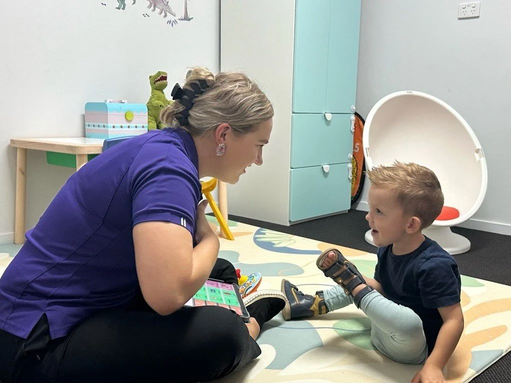 School-age child working on speech, language and communication skills with a speech pathologist