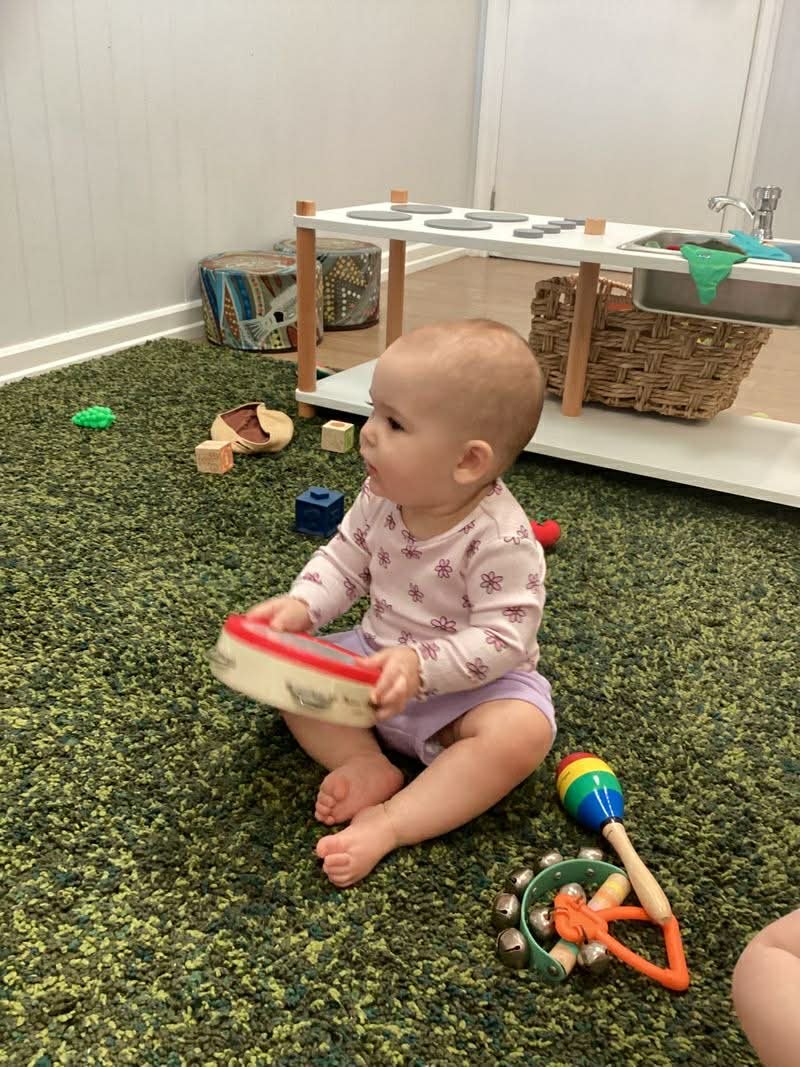Paediatric occupational therapist supporting play, regulation and early self-care skills