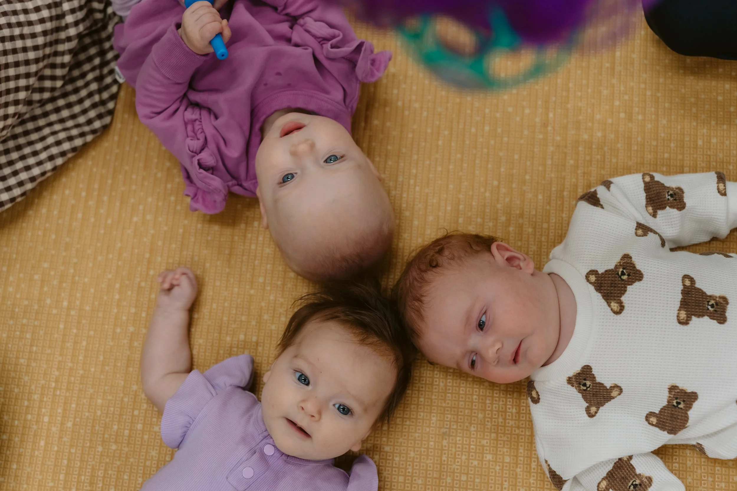 Paediatric physiotherapist supporting early motor development in a baby