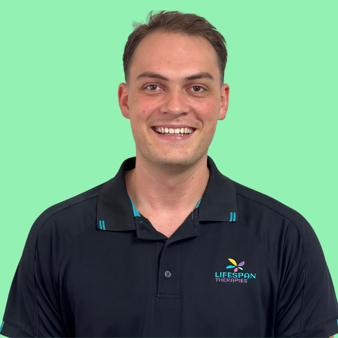 Occupational Therapist Ryan Hopkinson working with children and kids with disabilities at Lifespan Therapies in Strathpine, North Brisbane. Pictured smiling in a headshot against a green background.