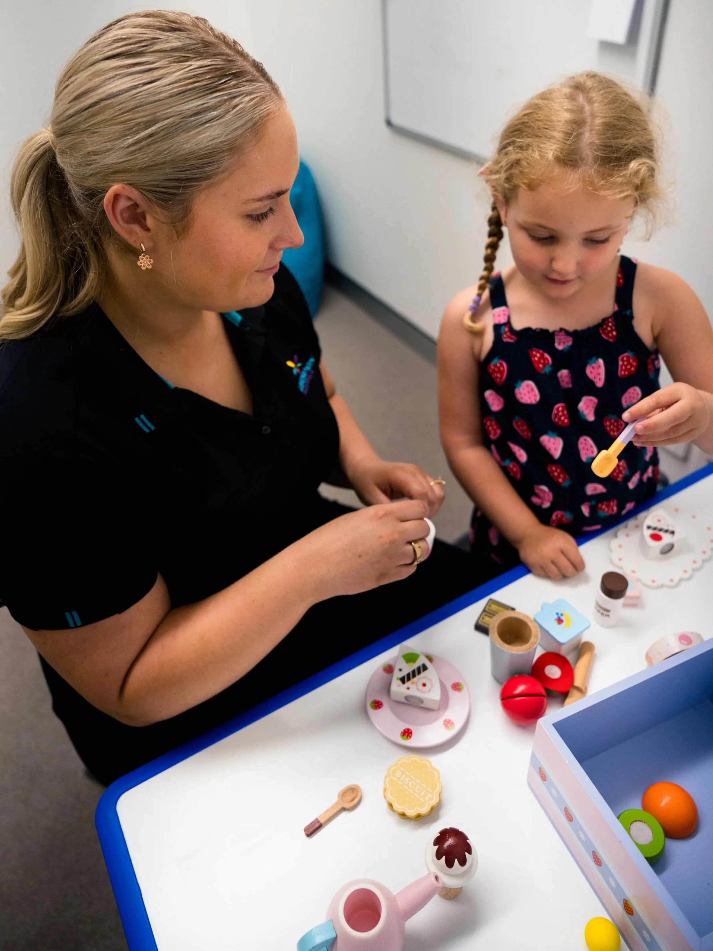 School-age child receiving paediatric therapy support for participation and development