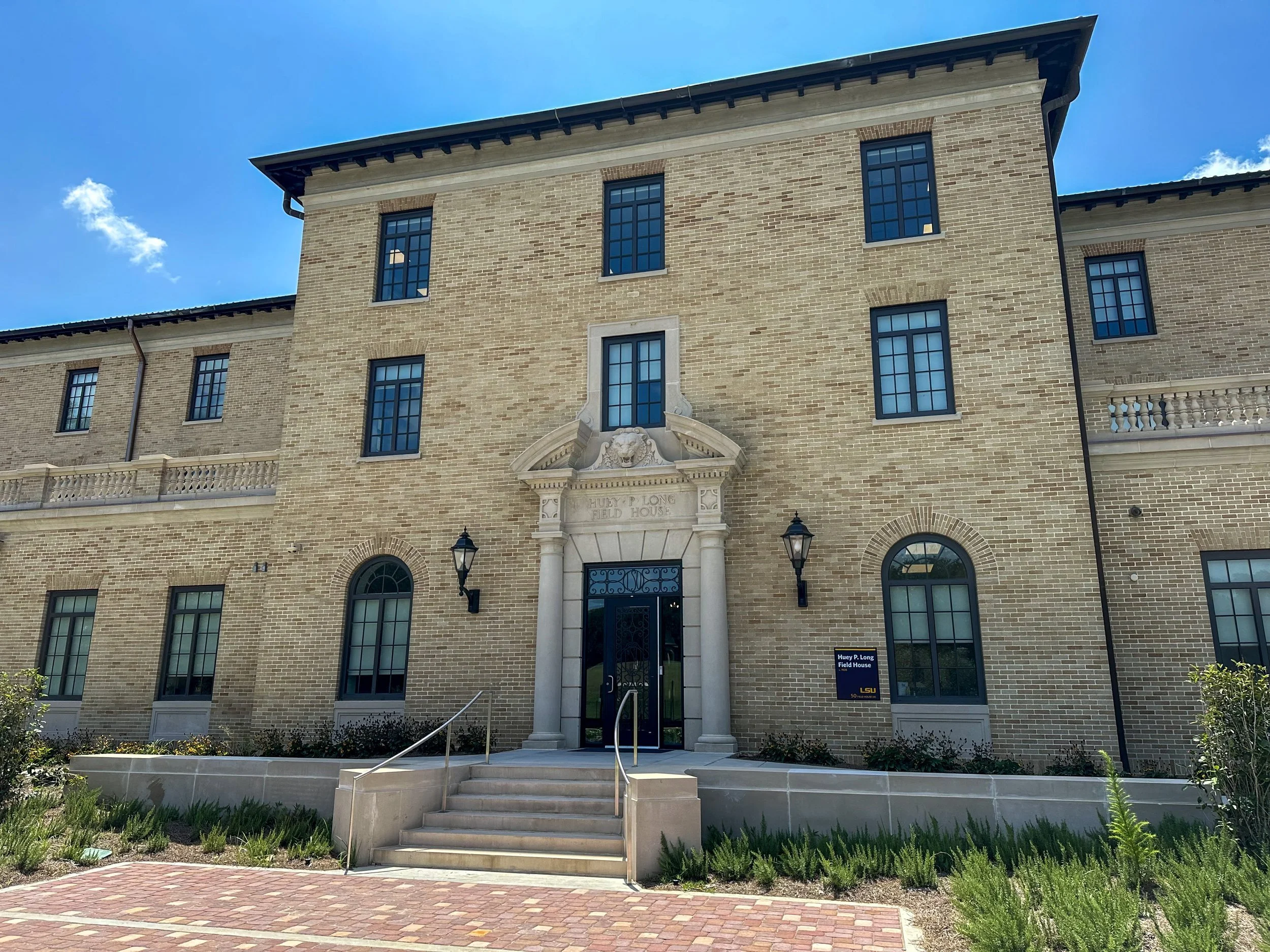 Restored brick and cast stone facade of the Huey P. Long Field House at LSU, a masonry renovation by Langlois Construction