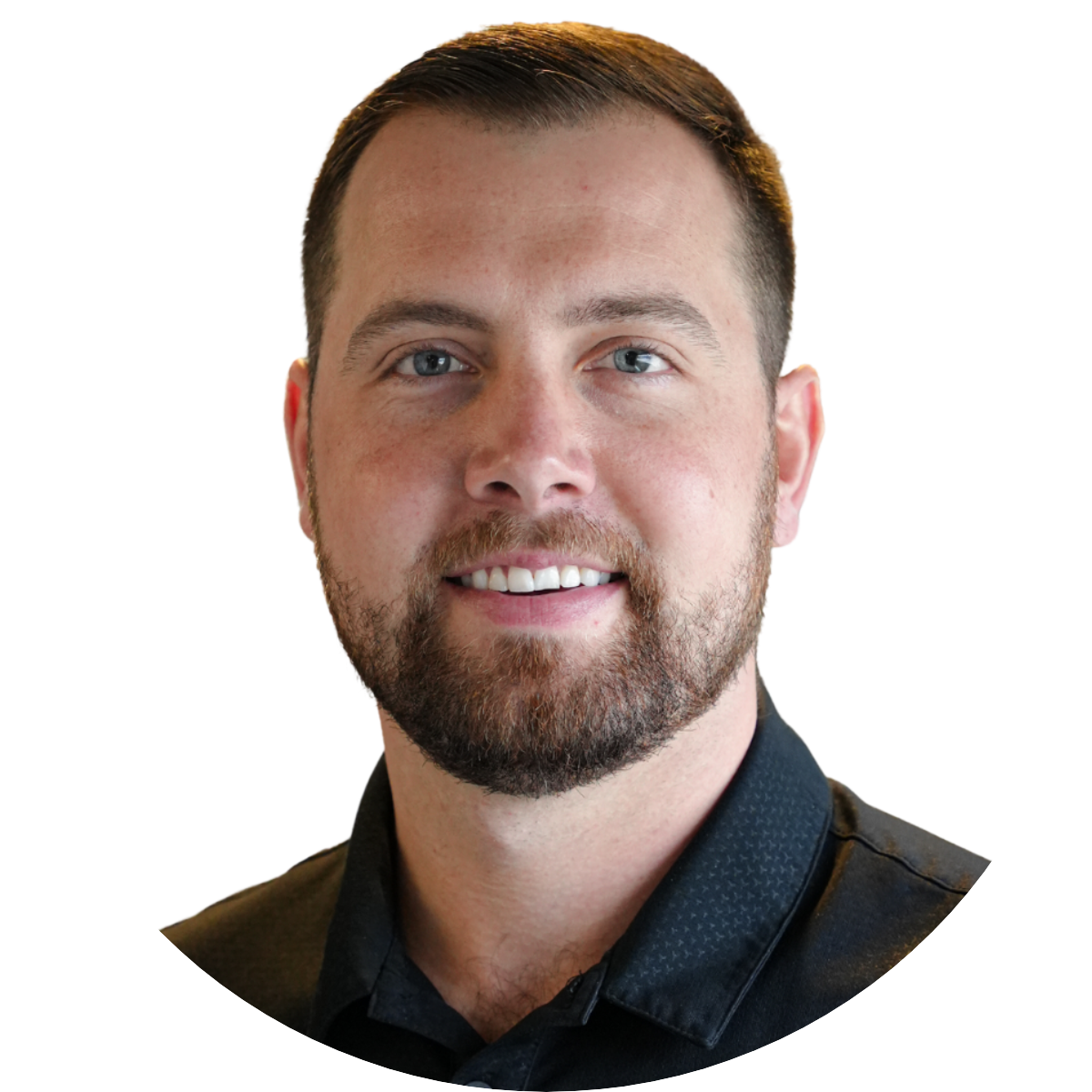 Headshot of a man with short brown hair, blue eyes, a beard, and wearing a dark collared shirt