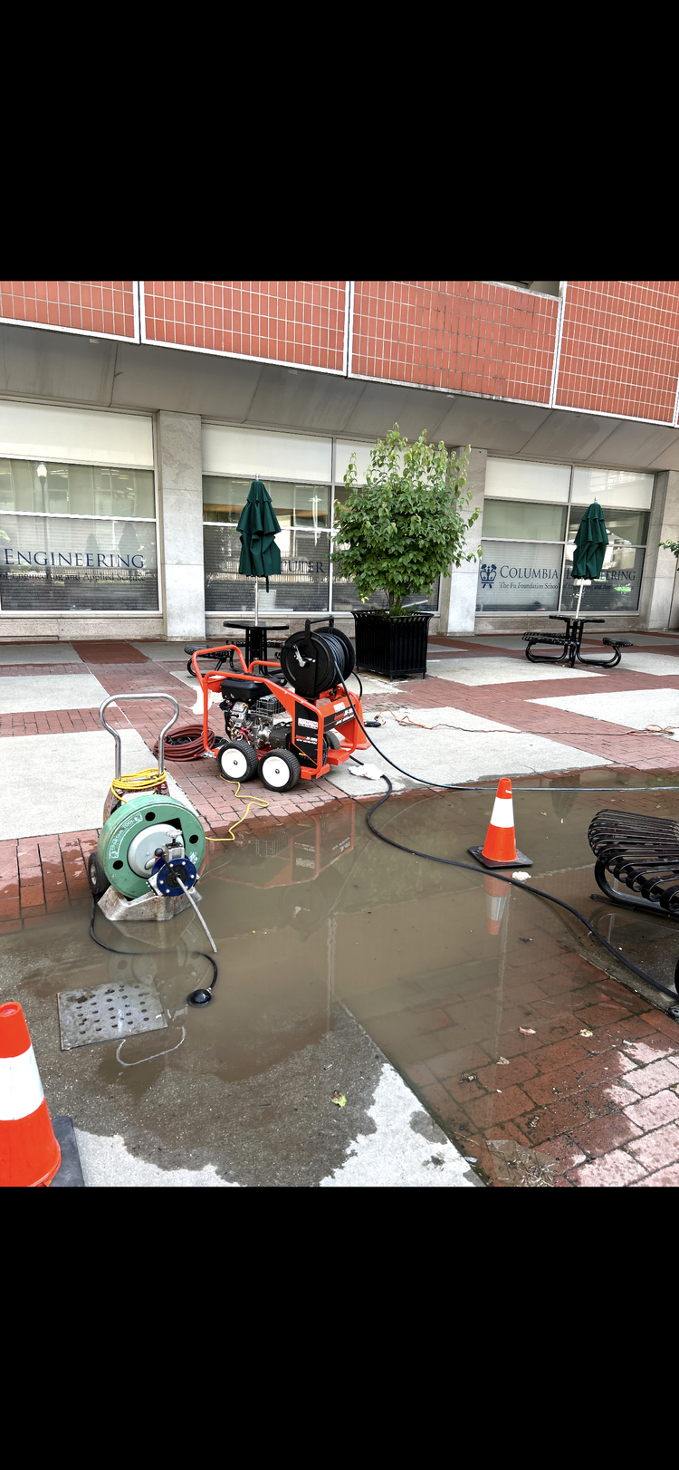 Drain jetting equipment set up at a commercial plaza