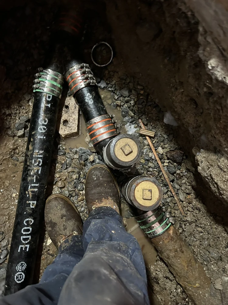 New sewer line with cleanouts in an excavated trench