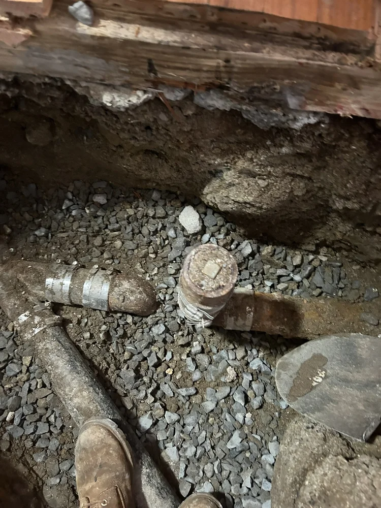 Sewer line repair under a floor
