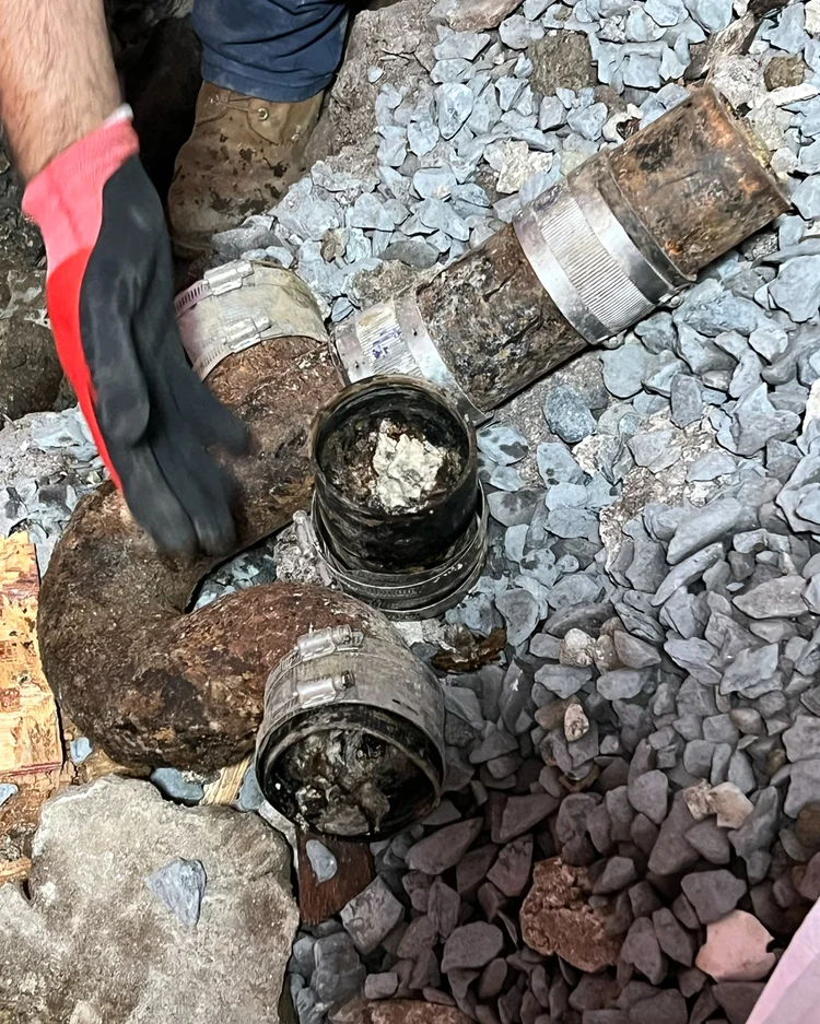 Old clogged sewer pipe cut out during a repair