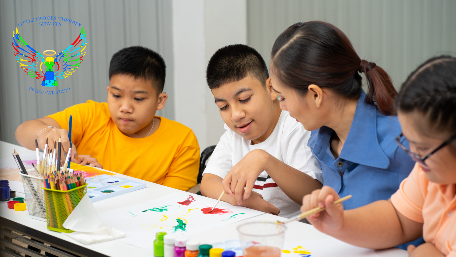 Therapist working with children during a painting activity
