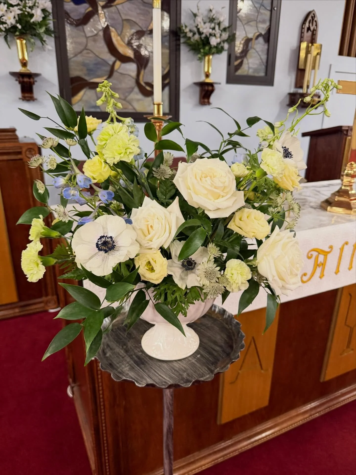 Last month, I had the privilege of making memorial flowers for my father in law, Bob Juhl. We kept the colors light and bright, just like Bob, and made sure he had some reds and oranges to complement his ever so fitting urn. 
I hope they were a refle