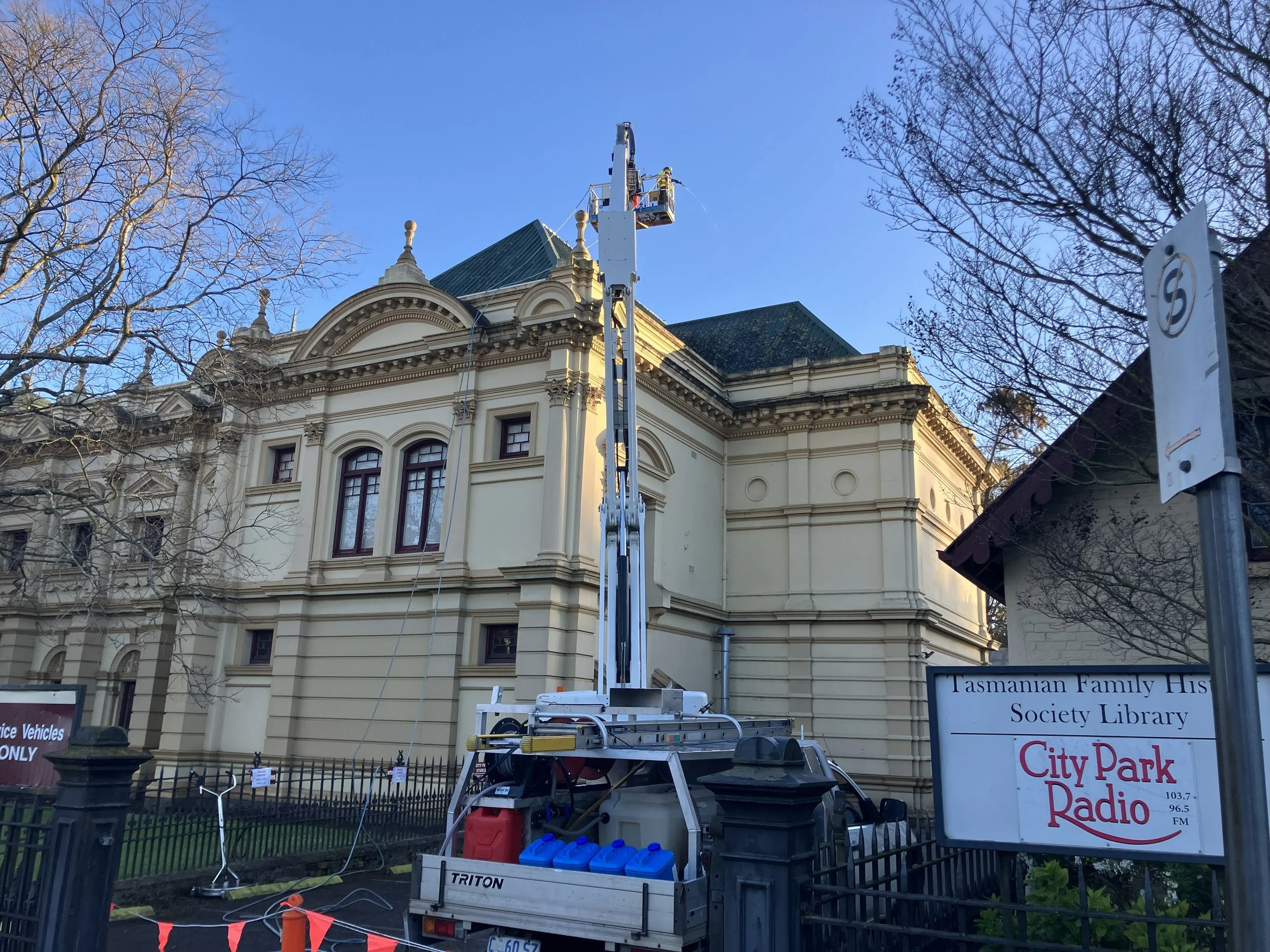 Professional cleaners cleaning the roof of the iconic Albert Hall in Launceston