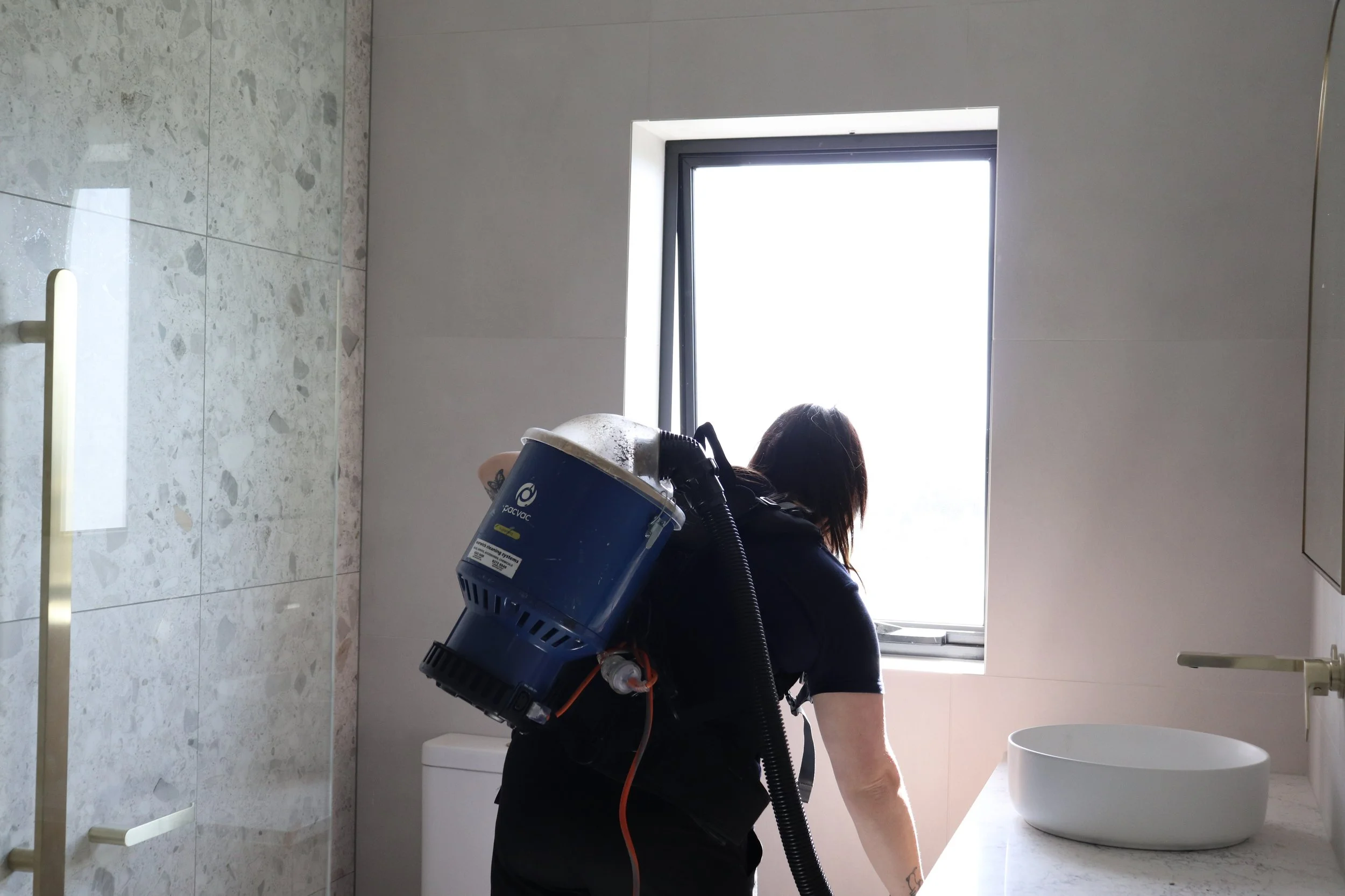 Cleaning a bathroom for a brand new house as a part of a builders clean in Tasmania