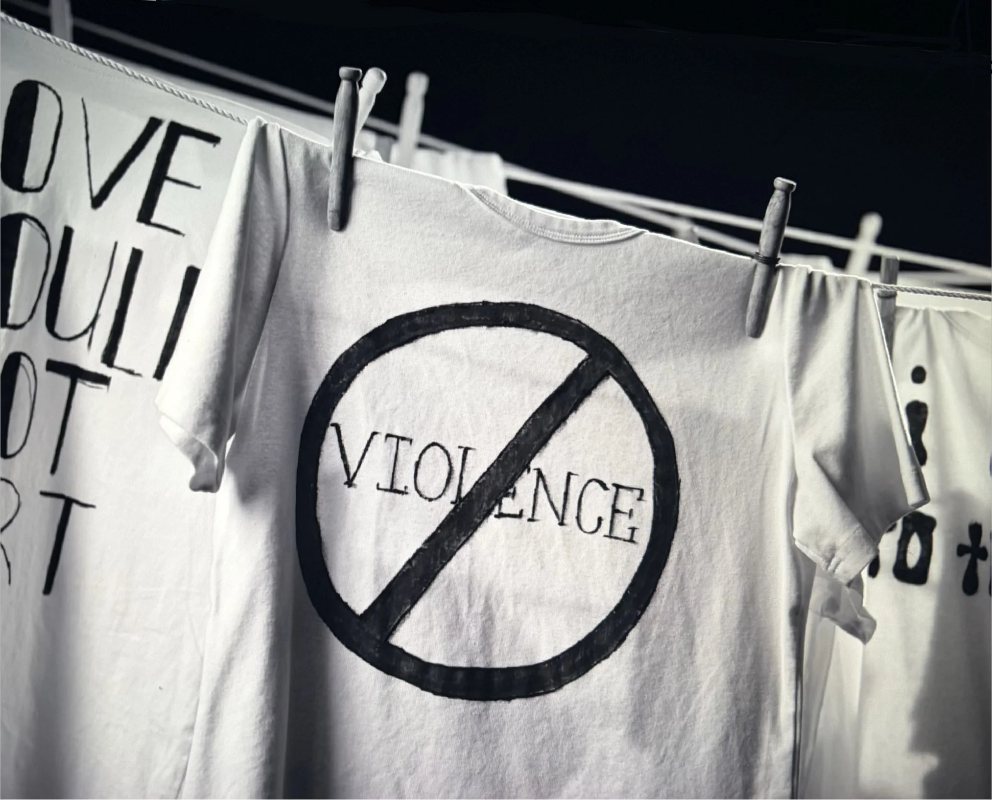 A t-shirt hangs on a clothesline - NO VIOLENCE