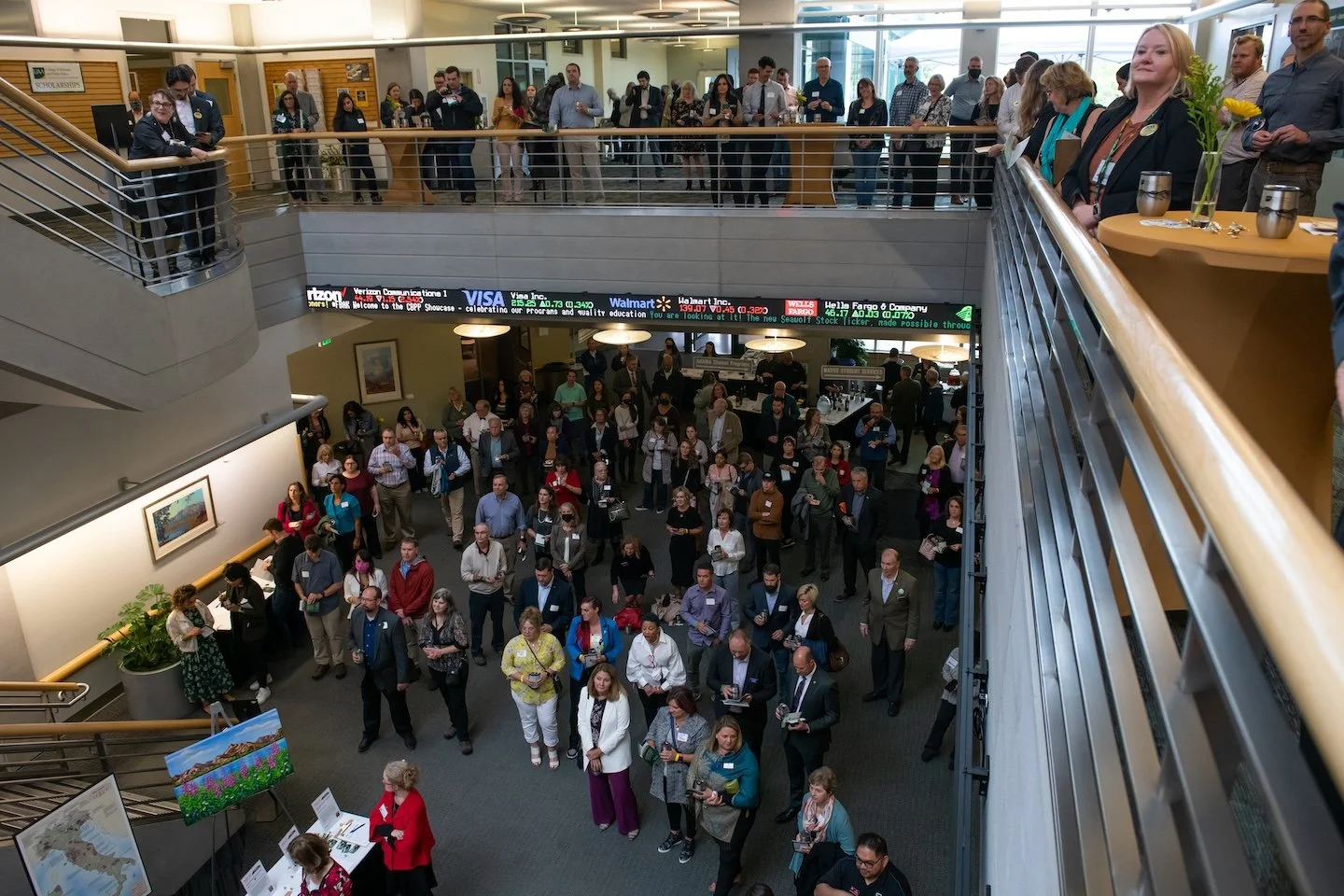 People gather on the first and second floors of Rasmuson Hall.