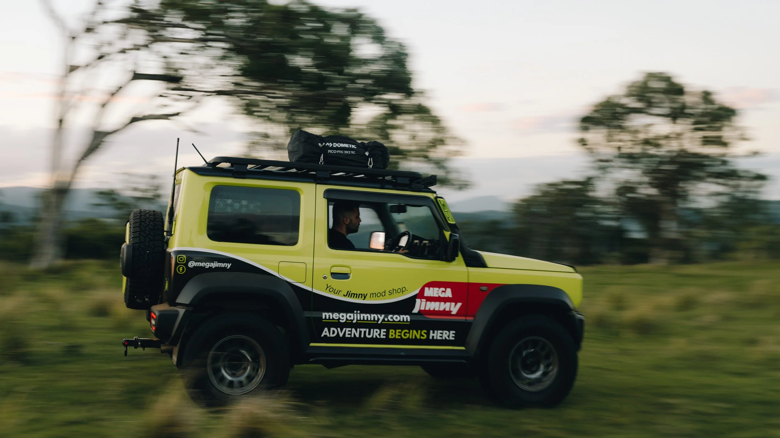 Jimny racing through nature