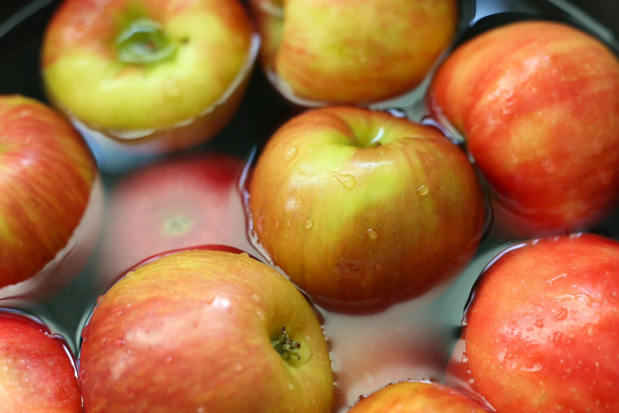 Apples soaking in a bowl of water