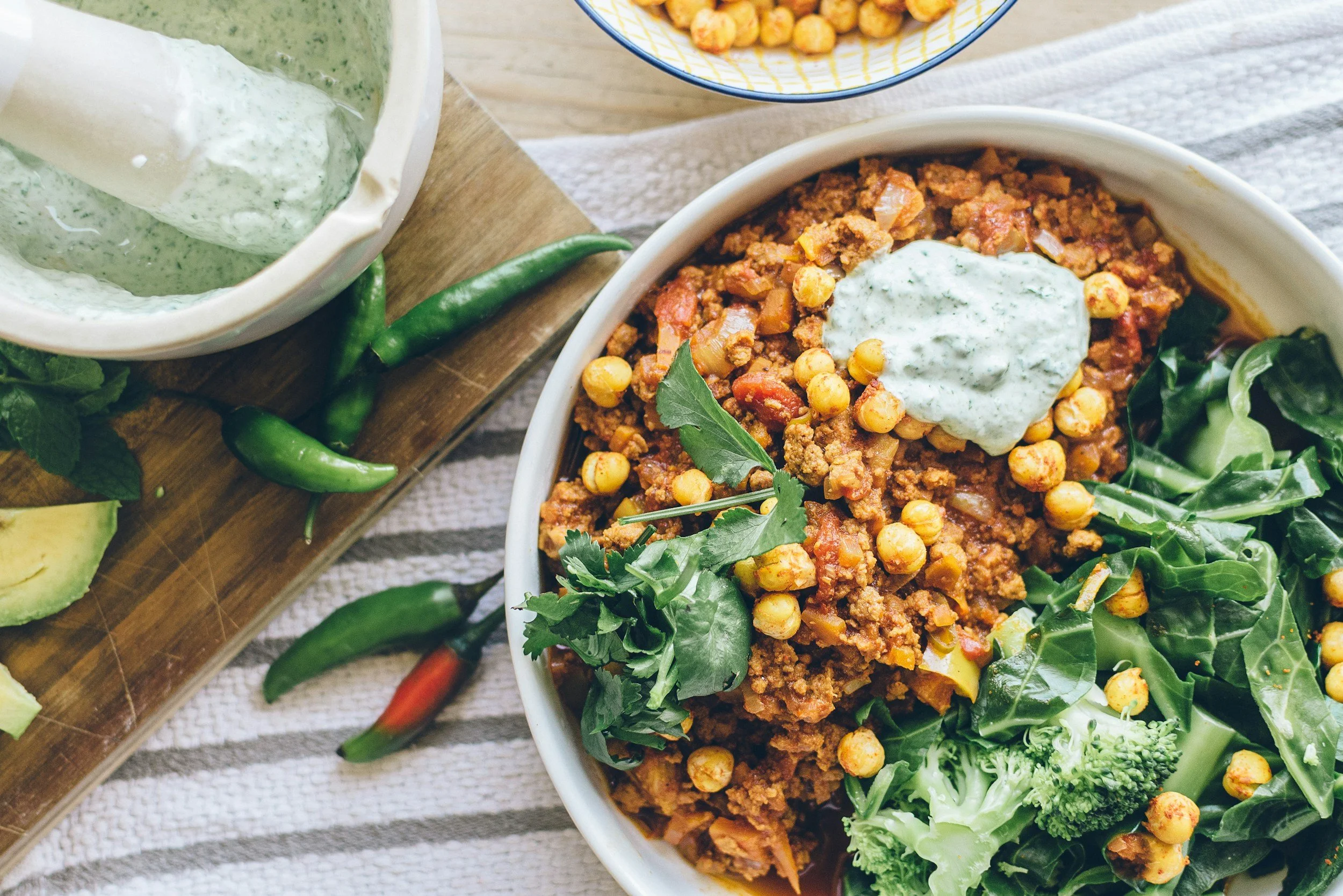 Bowl of lentils and chickpeas with herbs and vegetables
