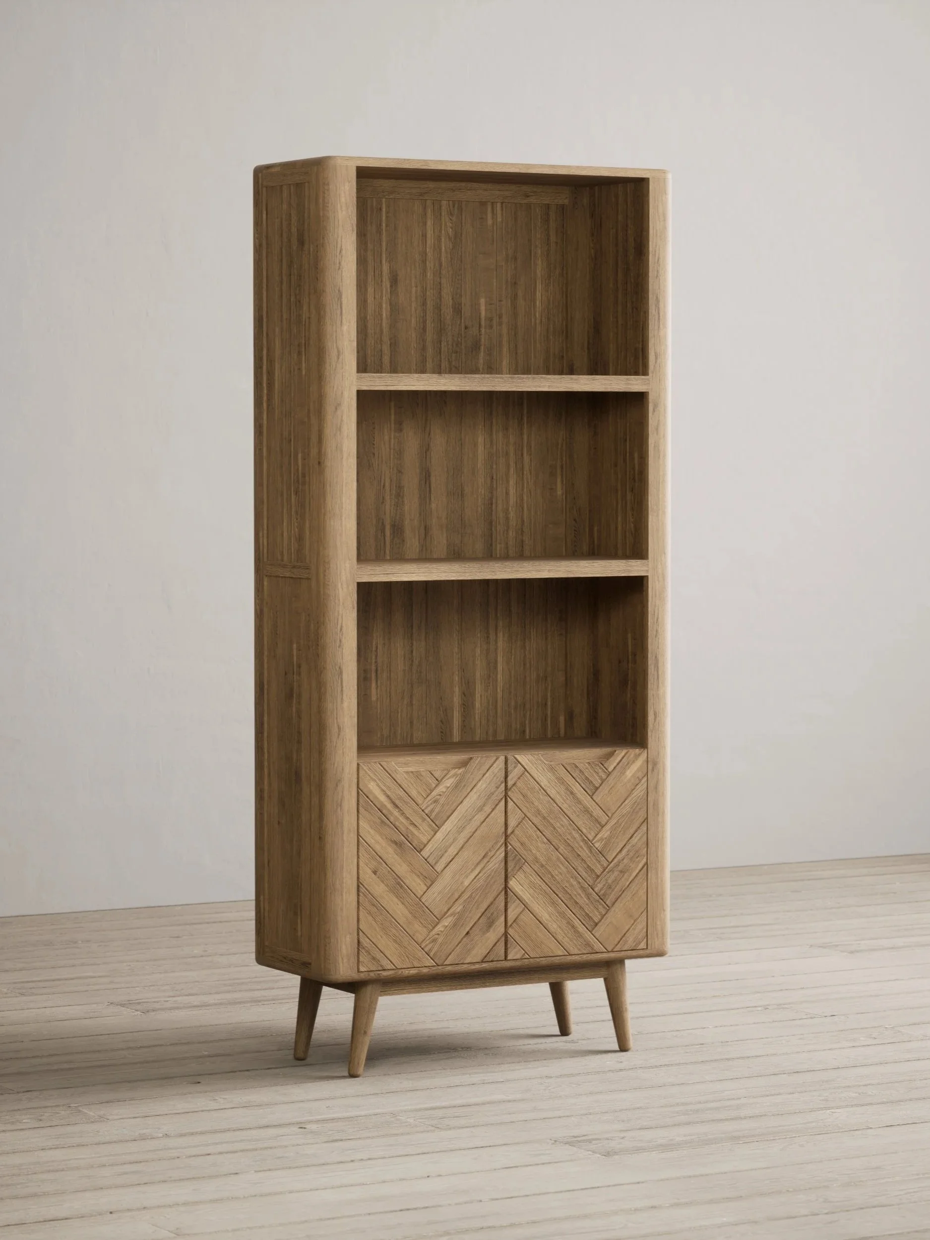 A wooden bookshelf with three open shelves and a closed cabinet with a geometric pattern, standing on four angled legs against a plain wall.