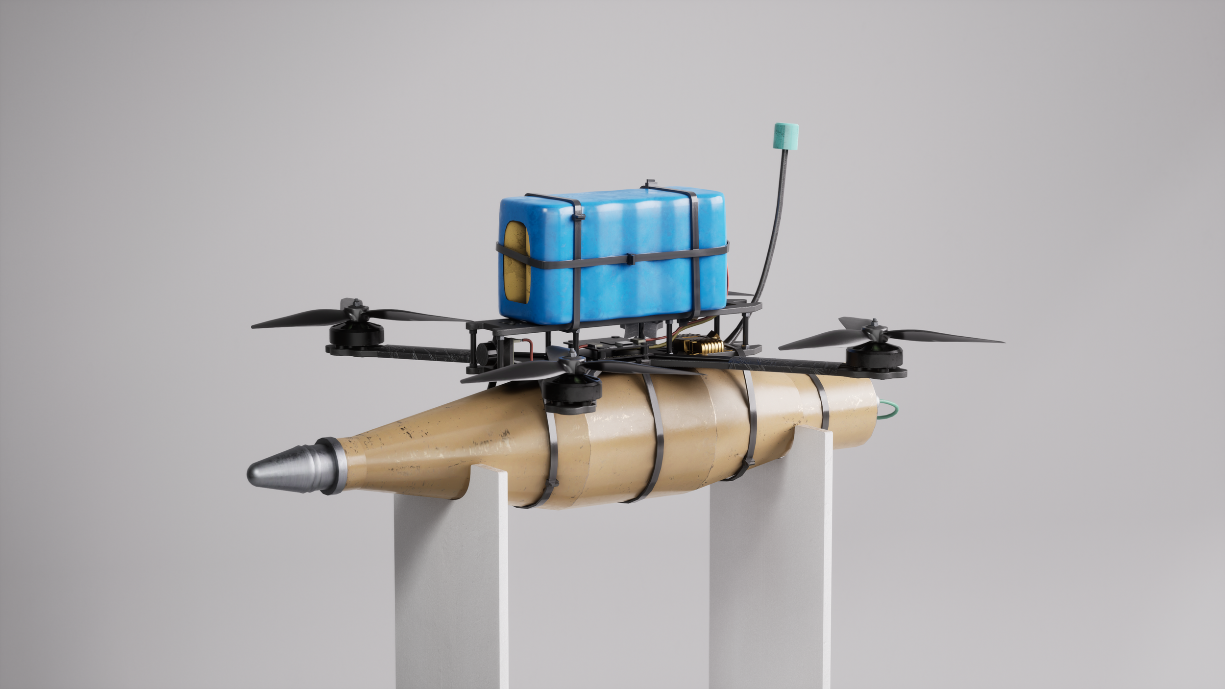 A homemade drone with a large cylindrical body, four propellers, a blue water container on top, and a metal nose, displayed on white pedestals against a gray background.