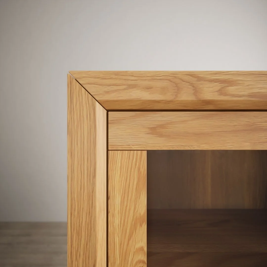 Close-up of corner of wooden furniture, showing detailed grain and craftsmanship.