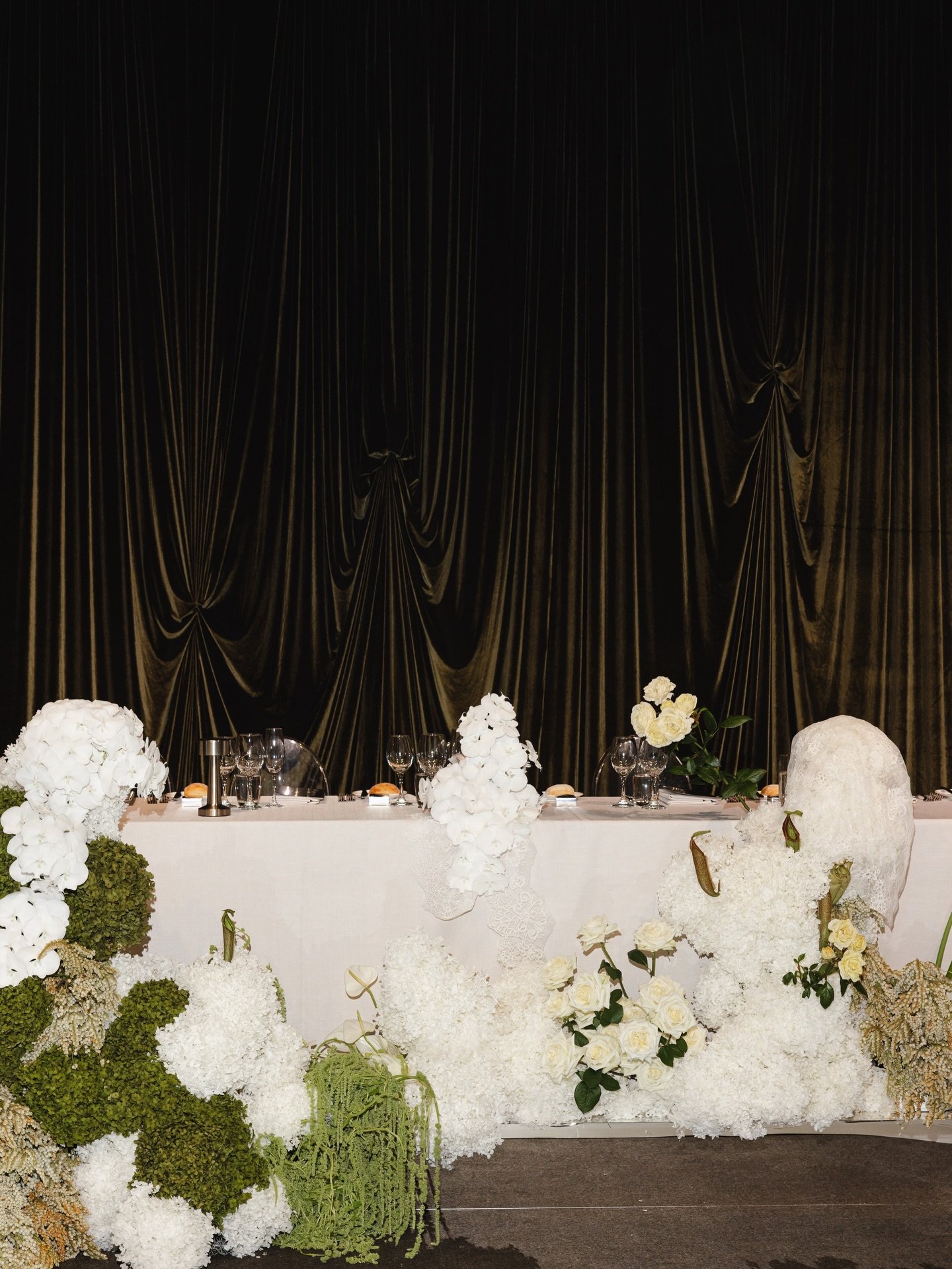 J&amp;A &mdash; Reflections of Grandeur
Set within the iconic halls of @ngvmelbourne, Reflections of Grandeur unfolded as a study in modern opulence. Luminous and deliberate, the celebration embraced the art of reflection through sculptural florals, 