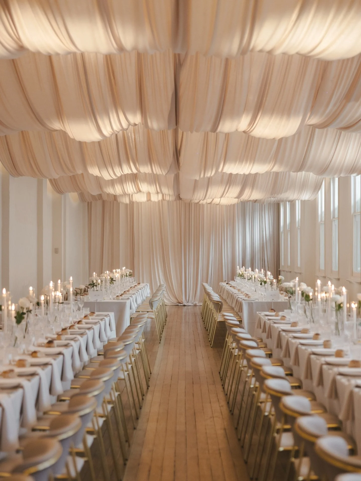 B&amp;A &mdash; A reception that transports you into a soft, romantic world. Where artful draping falls effortlessly, delicate hues wash the space in warmth, and candlelight sets the mood. An atmosphere designed to feel intimate, dreamy, and quietly 
